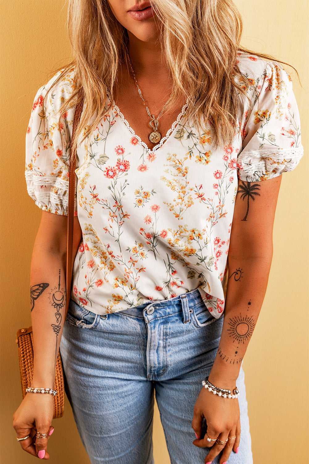 A stylish Boho Floral Lace Blouse featuring a vibrant floral pattern and delicate lace trim, perfect for casual or dressy occasions.