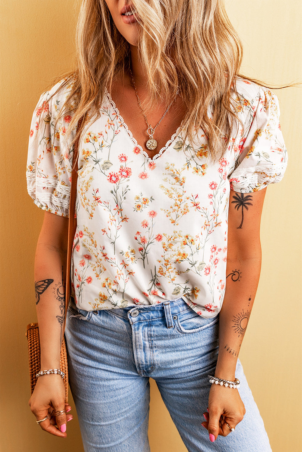 A stylish Boho Floral Lace Blouse featuring a vibrant floral pattern and delicate lace trim, perfect for casual or dressy occasions.