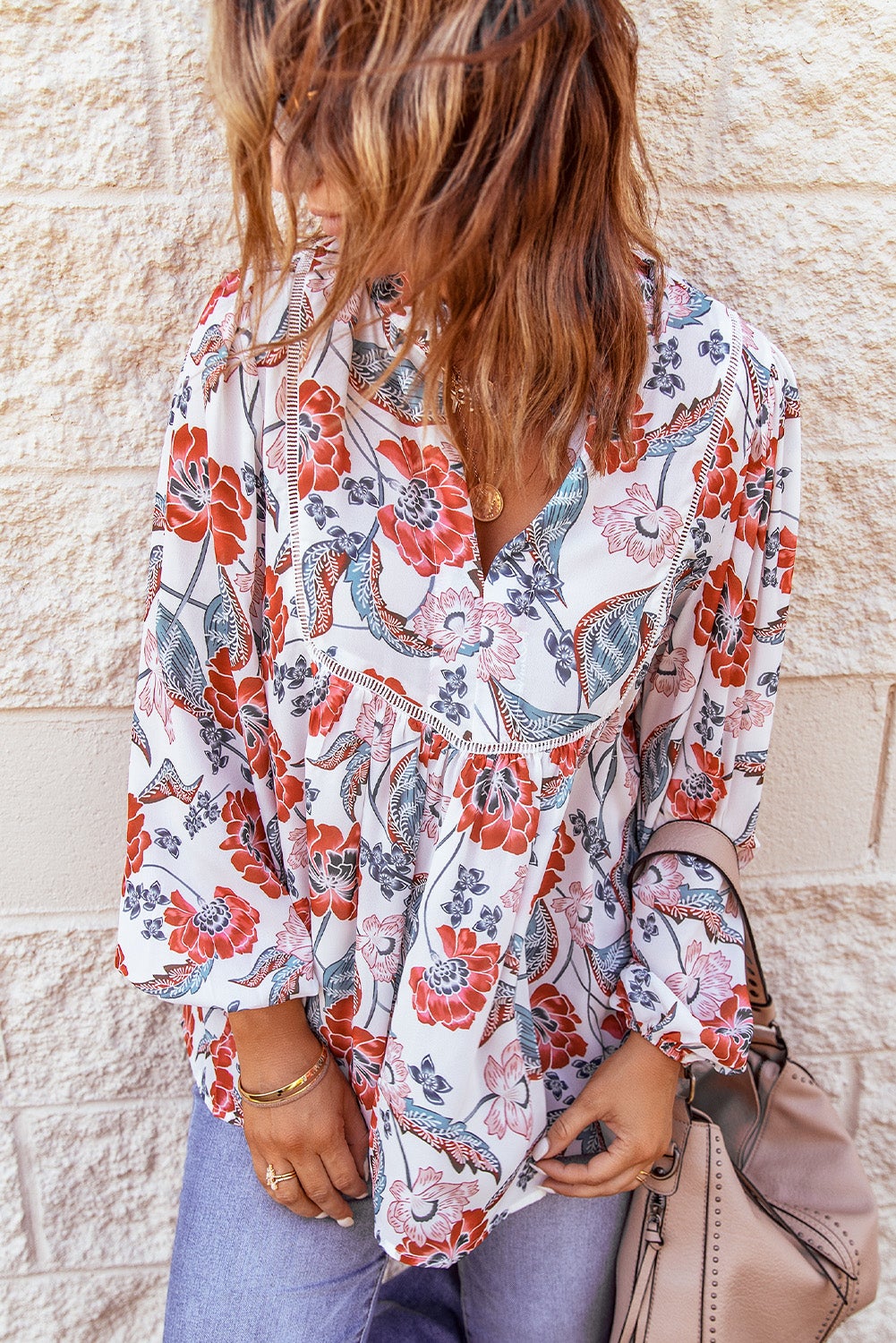 A stylish Bubble Sleeve Floral Blouse featuring a unique floral patchwork design, split v-neck, and bubble sleeves, perfect for casual and dressy occasions.