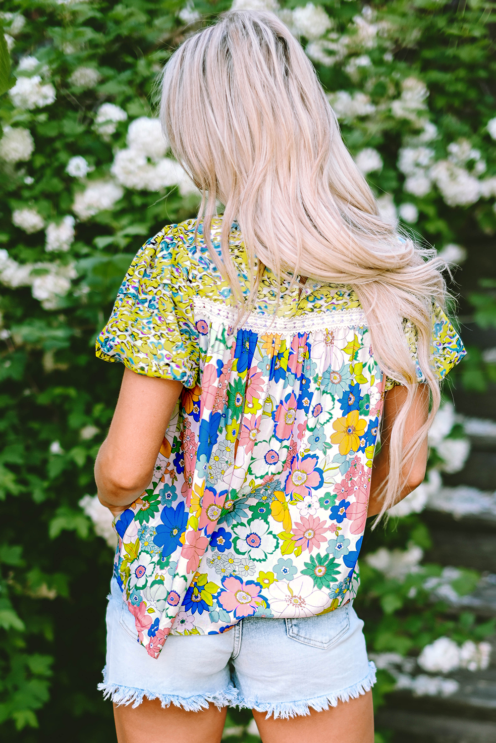 A stylish Bubble Sleeve Lace Trim Floral Blouse featuring a vibrant floral print and delicate lace detailing, perfect for casual and formal occasions.