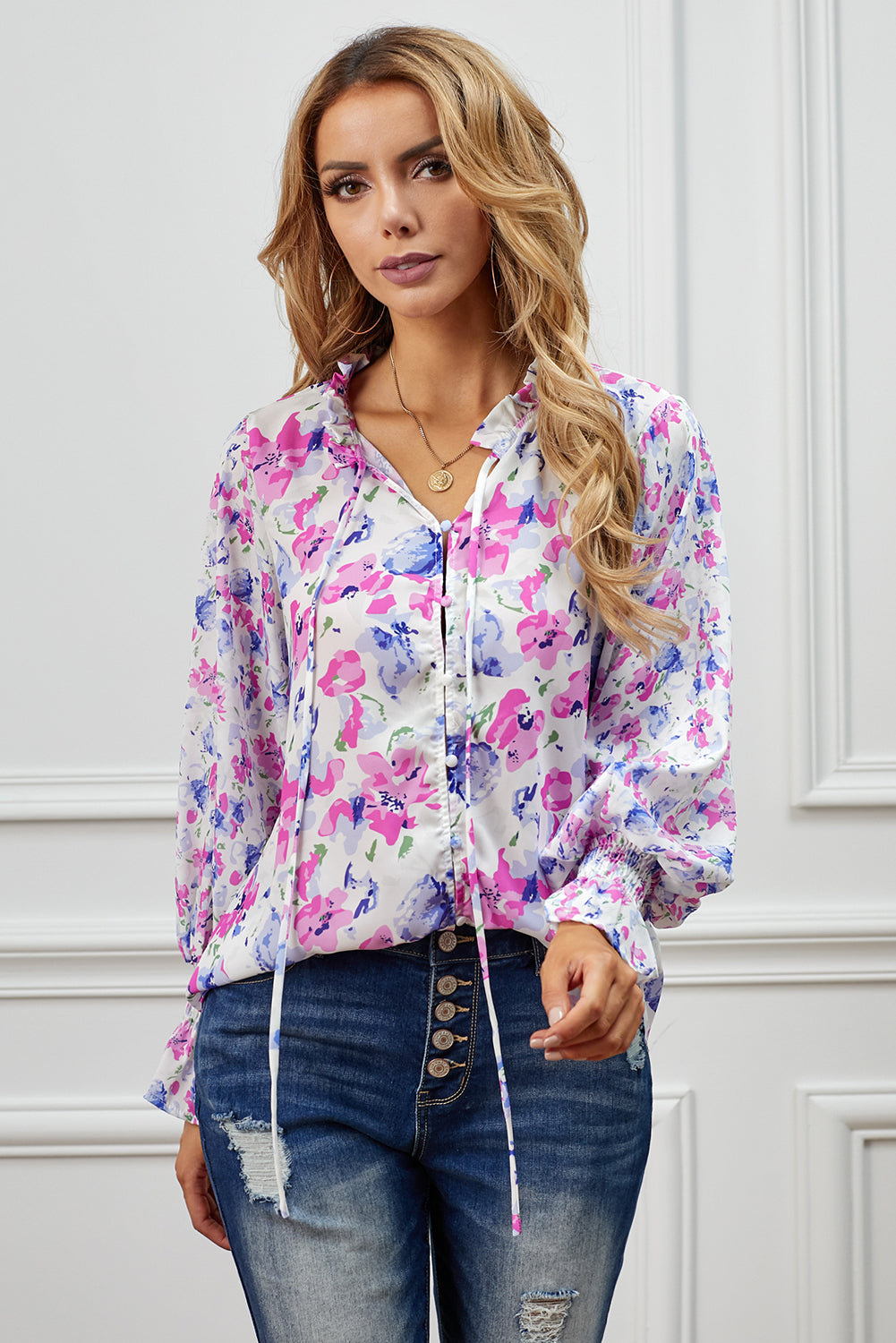 Chic Rose Cakewalk Floral Smocked Long Sleeve Blouse featuring ruffled neckline and billowy sleeves in a soft rose color.