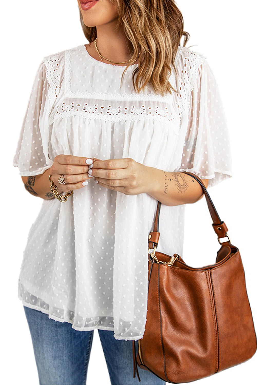 Chic white babydoll top with flutter sleeves and sheer textured design, perfect for summer wear.