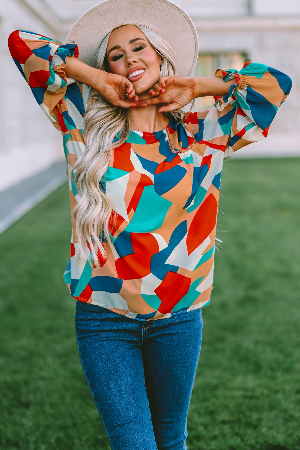 Elegant Crewneck Ruffled Puff Sleeve Blouse with ruffled sleeves and a fitted silhouette, perfect for spring and summer events.