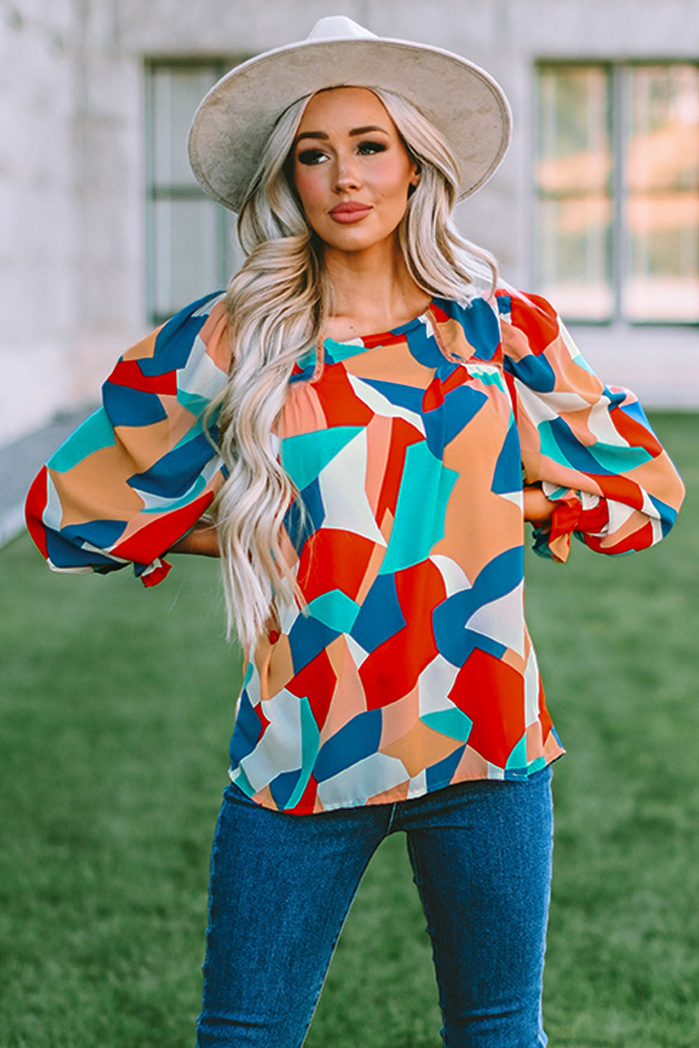 Elegant Crewneck Ruffled Puff Sleeve Blouse with ruffled sleeves and a fitted silhouette, perfect for spring and summer events.