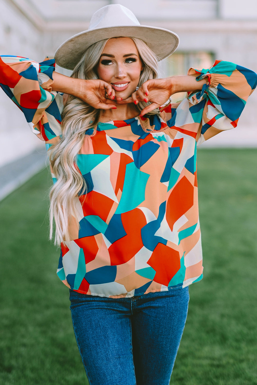 Elegant Crewneck Ruffled Puff Sleeve Blouse with ruffled sleeves and a fitted silhouette, perfect for spring and summer events.