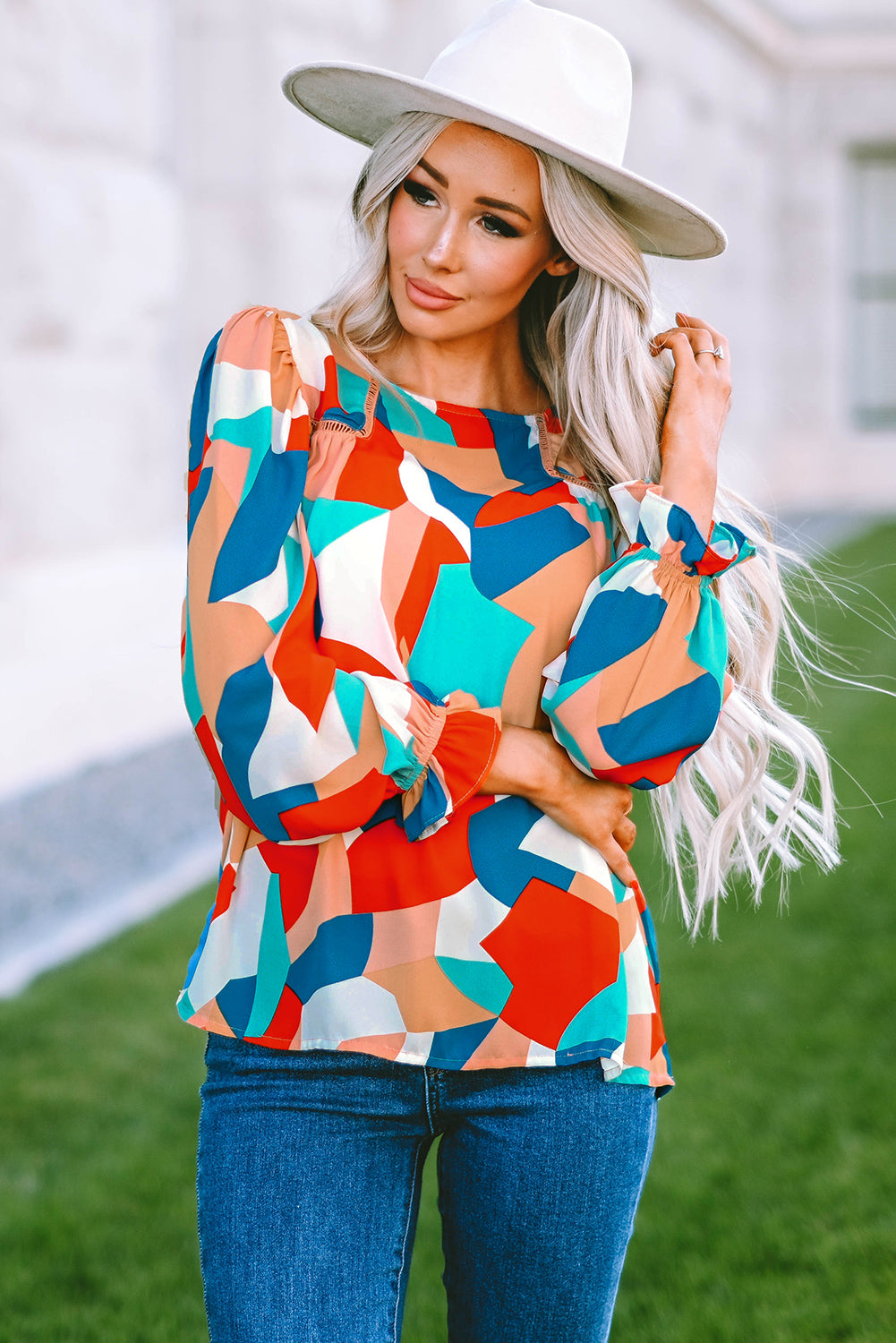 Elegant Crewneck Ruffled Puff Sleeve Blouse with ruffled sleeves and a fitted silhouette, perfect for spring and summer events.