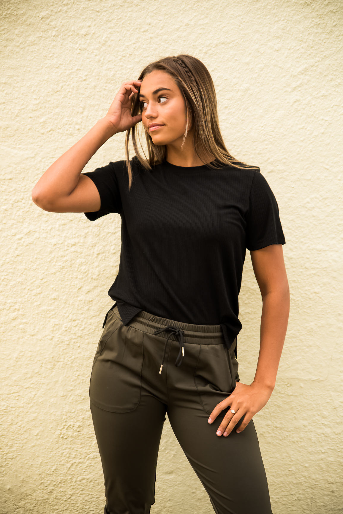 DT Alyssa Rib Knit Split Hem Tee in Black, showcasing its cozy ribbed fabric and stylish split hem design.