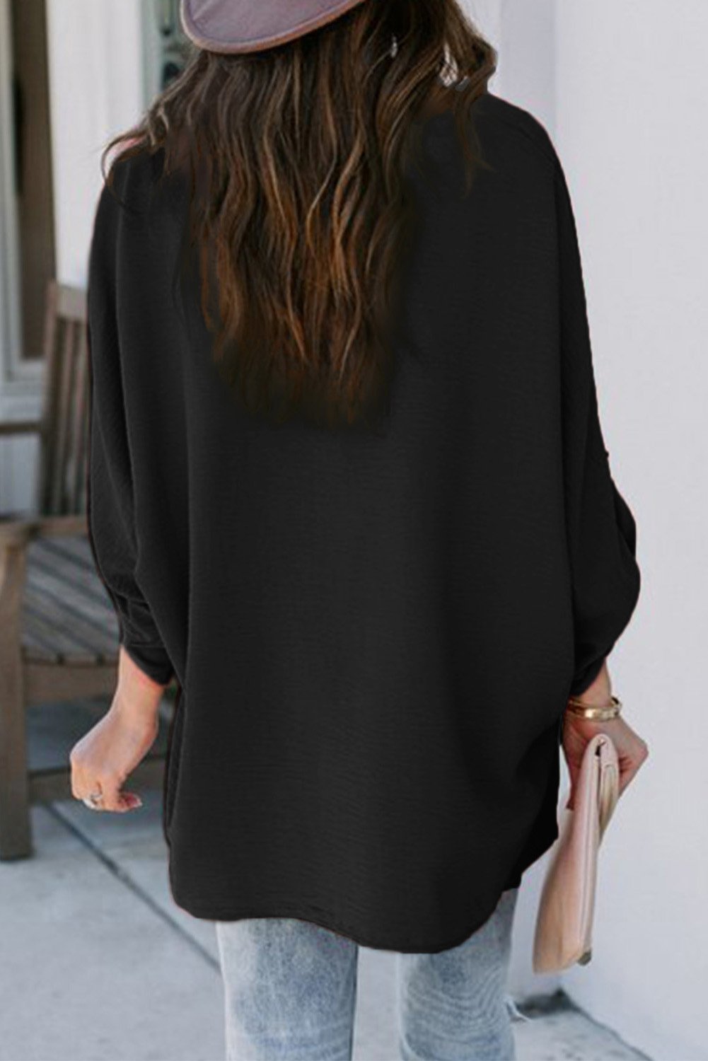 Elegant Black V Neck 3/4 Sleeve High Low Hem Shirt displayed on a mannequin, showcasing its stylish design and high low hemline.