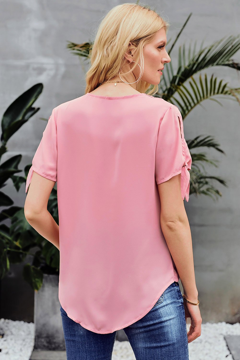 Elegant Pink Charismatic Drape Short Sleeve Blouse with v-neckline and tie sleeves, perfect for summer occasions.