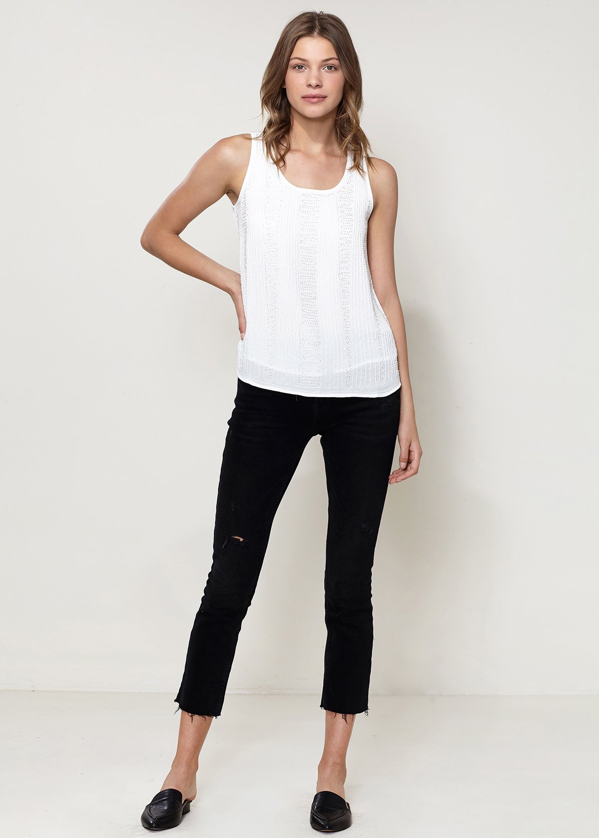 Embellished Accent Sleeveless Top in Ivory featuring elegant embellishments and a stylish round hem.