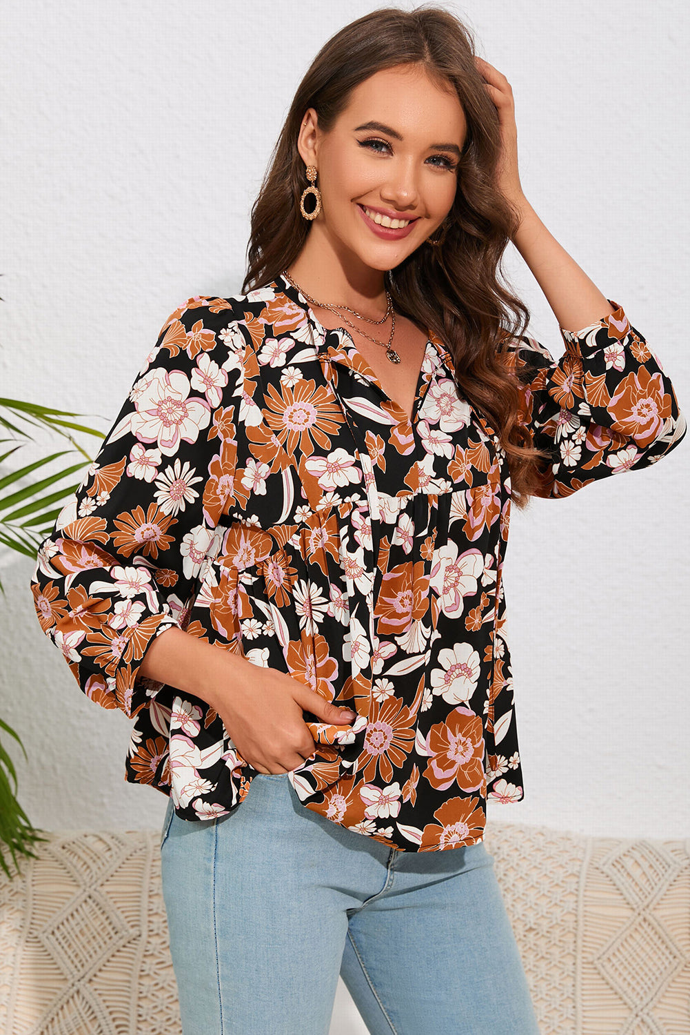 A stylish Floral Babydoll Blouse featuring a vibrant floral pattern, tie split neck, and bracelet sleeves, perfect for any occasion.