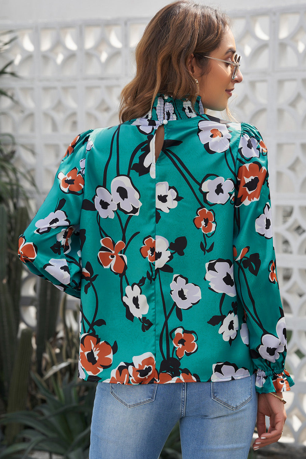 A stylish Floral Print Mock Neck Blouse featuring vibrant floral patterns, bubble sleeves, and ruffle cuffs, perfect for casual occasions.