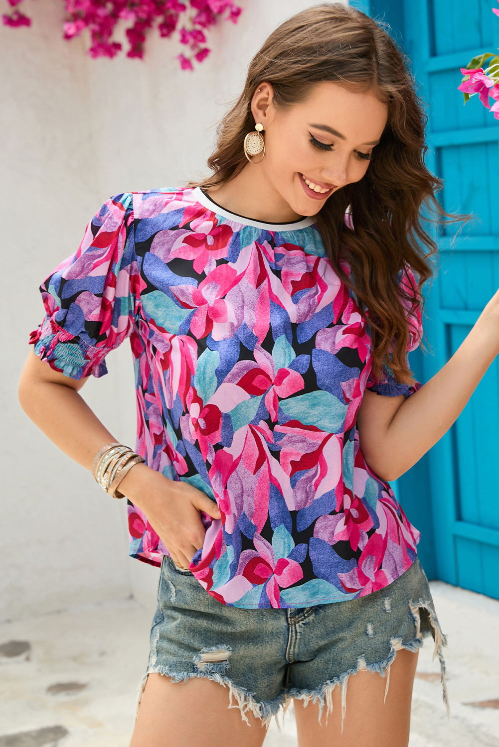 Floral Print Shirred Puff Blouse featuring vibrant colors and dramatic puff sleeves, perfect for any occasion.