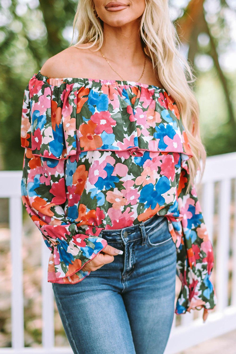 A stylish Floral Ruffled Off Shoulder Blouse featuring a vibrant floral print and elegant ruffles, perfect for various occasions.