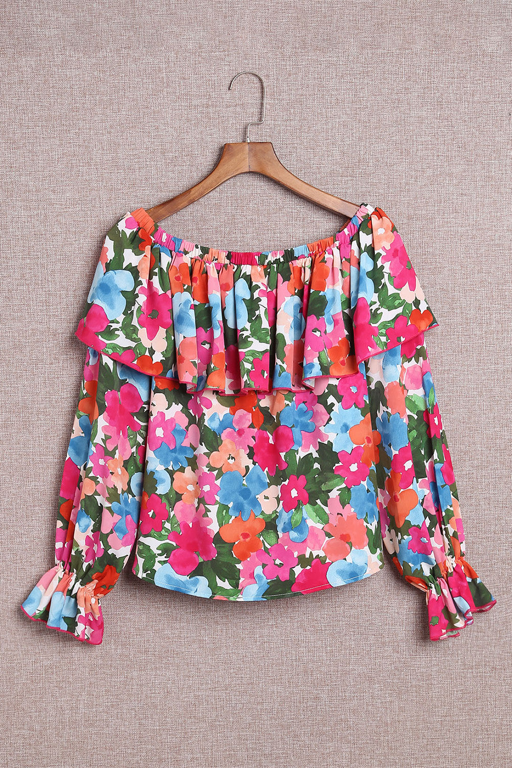 A stylish Floral Ruffled Off Shoulder Blouse featuring a vibrant floral print and elegant ruffles, perfect for various occasions.