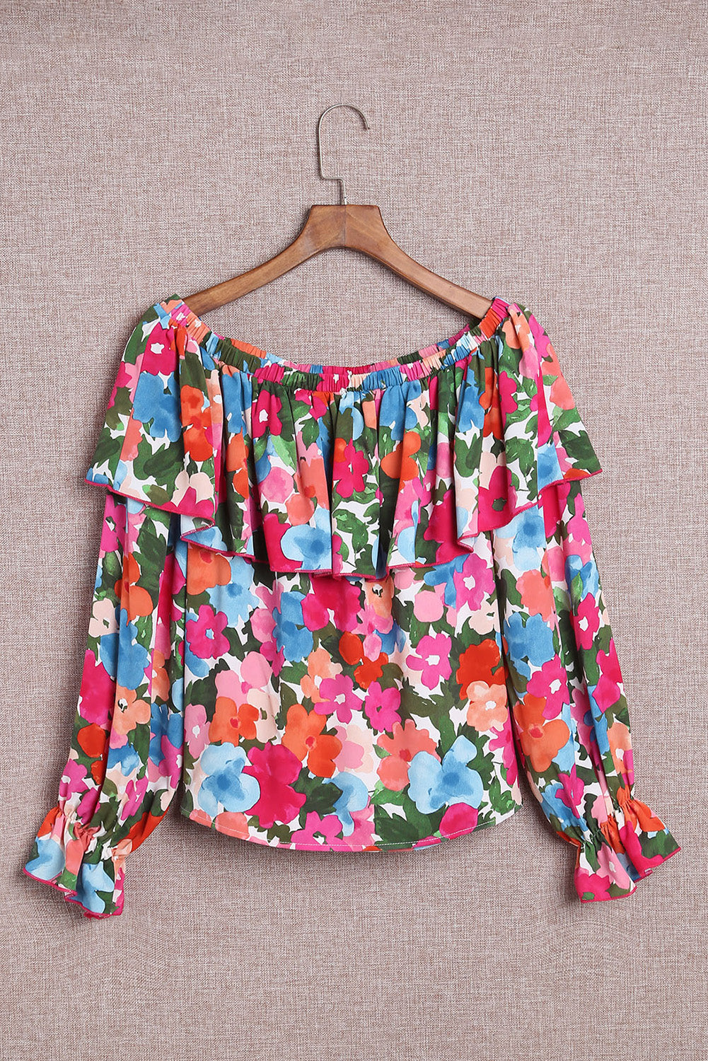 A stylish Floral Ruffled Off Shoulder Blouse featuring a vibrant floral print and elegant ruffles, perfect for various occasions.