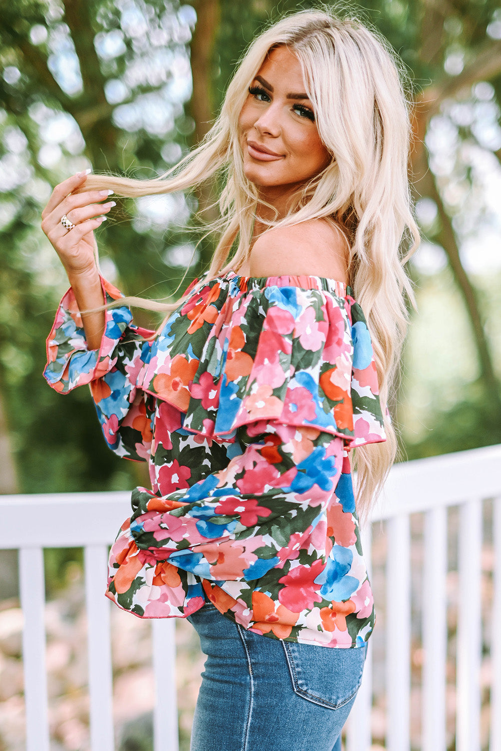 A stylish Floral Ruffled Off Shoulder Blouse featuring a vibrant floral print and elegant ruffles, perfect for various occasions.