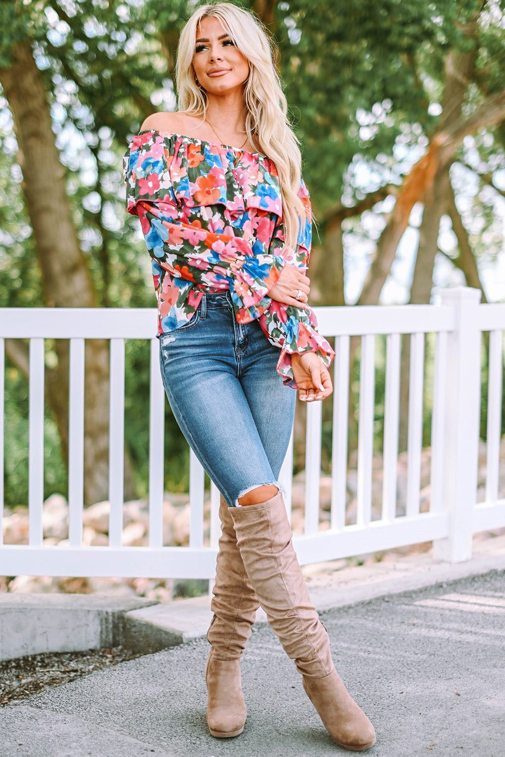 A stylish Floral Ruffled Off Shoulder Blouse featuring a vibrant floral print and elegant ruffles, perfect for various occasions.