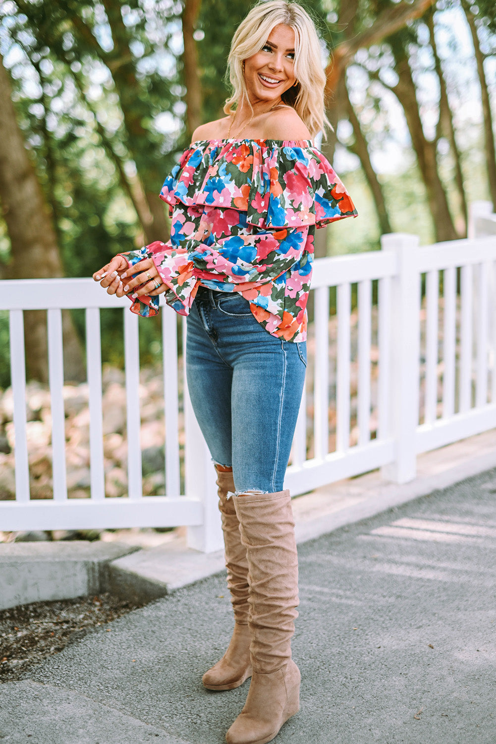 A stylish Floral Ruffled Off Shoulder Blouse featuring a vibrant floral print and elegant ruffles, perfect for various occasions.