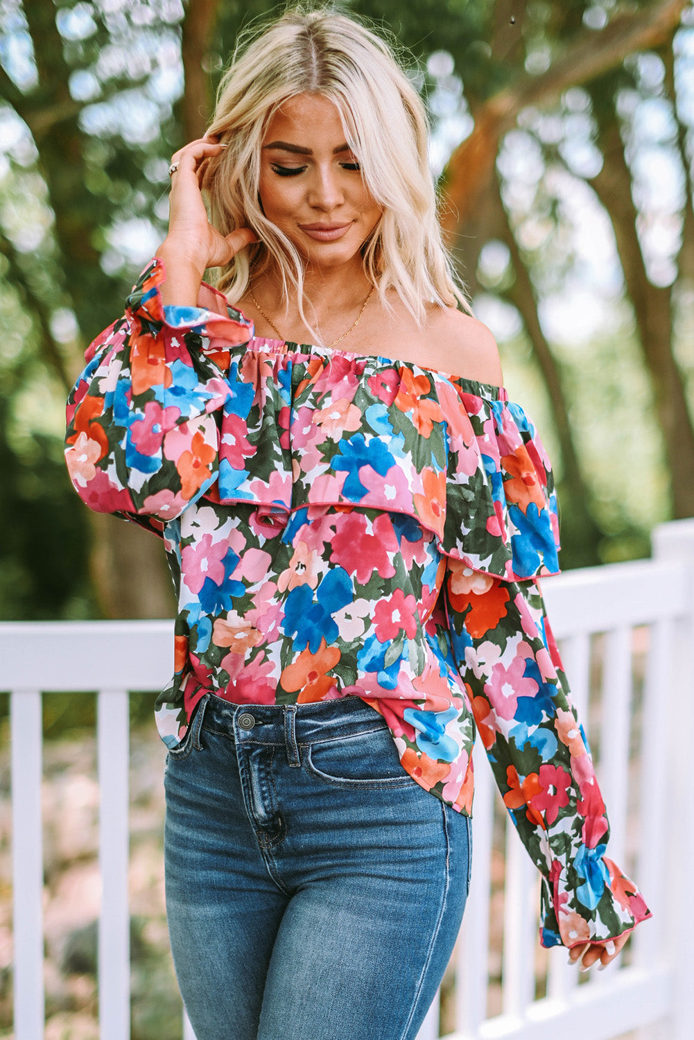 A stylish Floral Ruffled Off Shoulder Blouse featuring a vibrant floral print and elegant ruffles, perfect for various occasions.