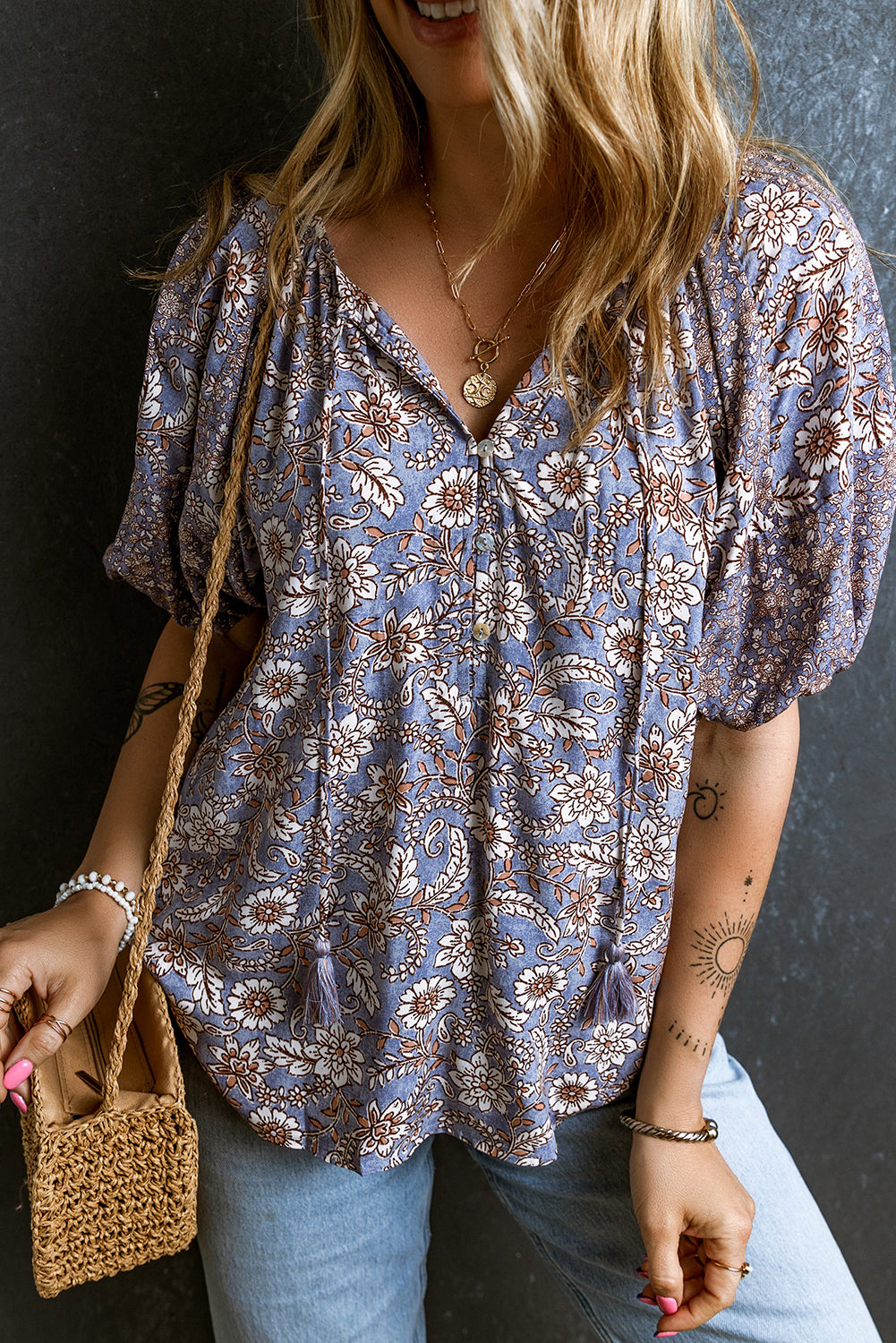 Floral Tassel Tie Split Neck Bubble Sleeve Blouse featuring a chic split V-neck, playful bubble sleeves, and a charming fringed tie detail.