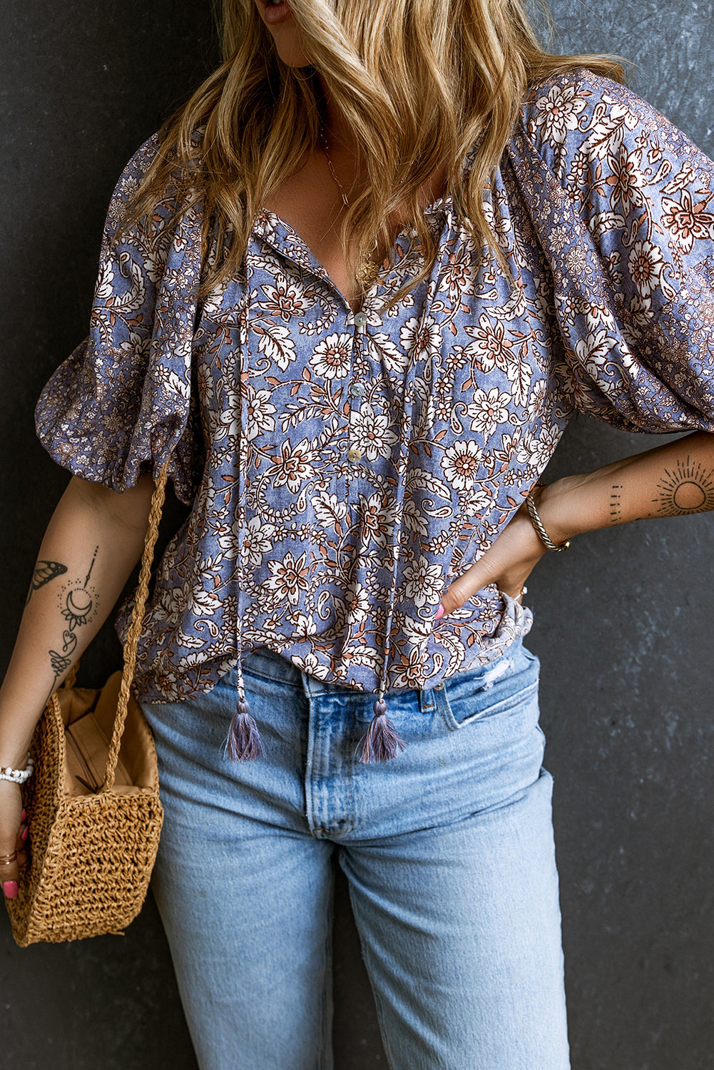 Floral Tassel Tie Split Neck Bubble Sleeve Blouse featuring a chic split V-neck, playful bubble sleeves, and a charming fringed tie detail.