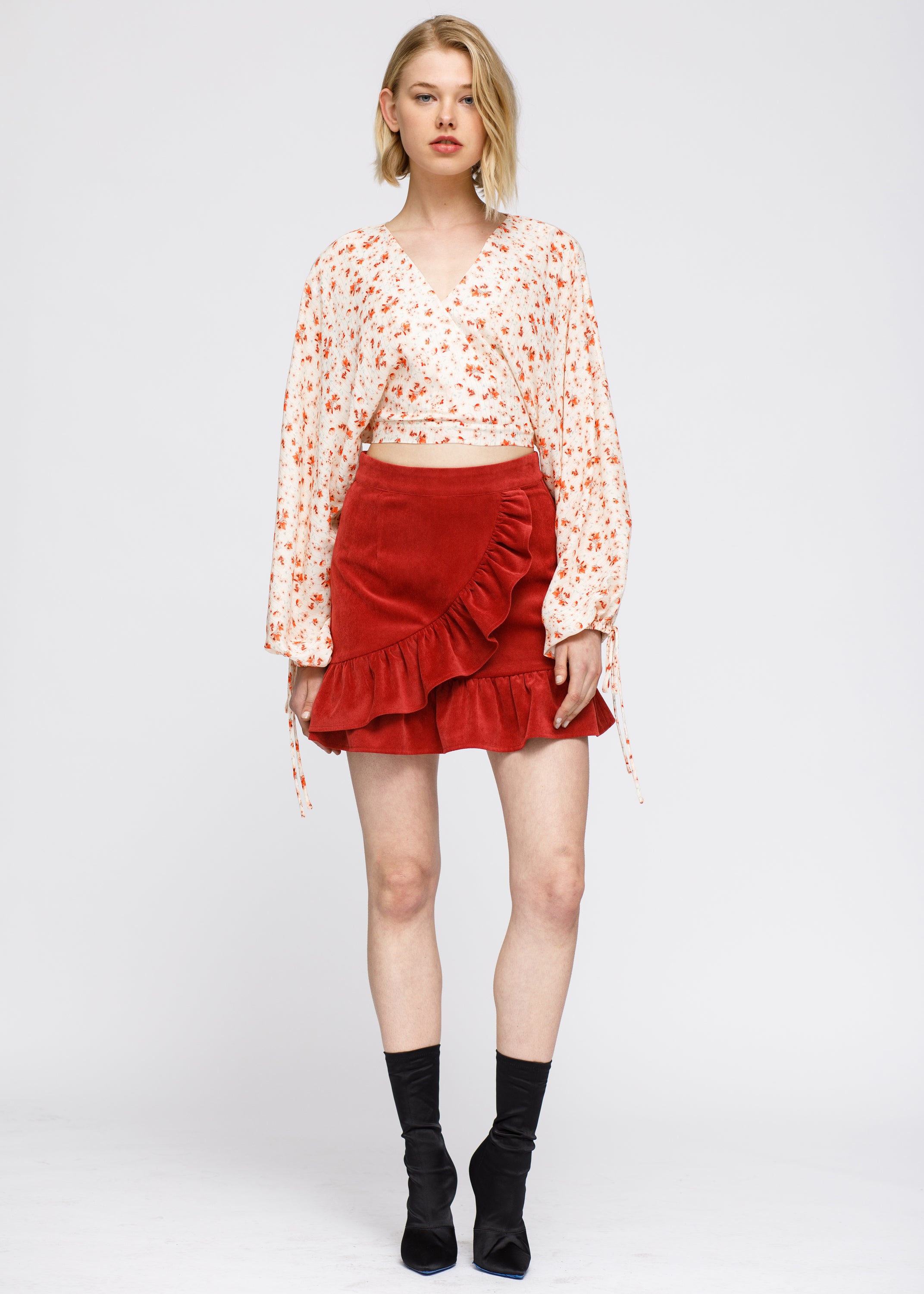 Floral Wrap Front Crop Blouse in Coral Gold featuring a vibrant floral pattern and stylish wrap design.