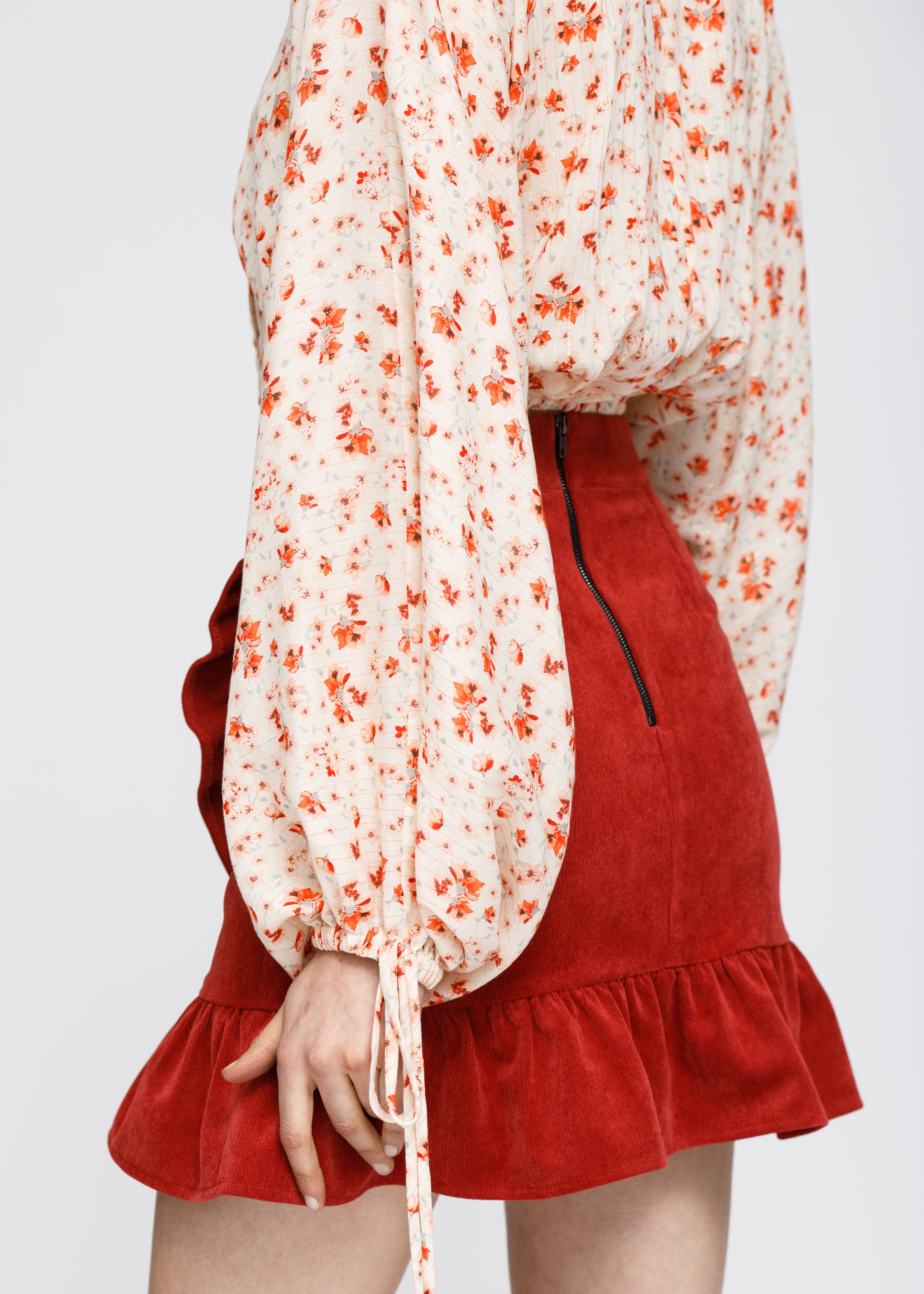 Floral Wrap Front Crop Blouse in Coral Gold featuring a vibrant floral pattern and stylish wrap design.