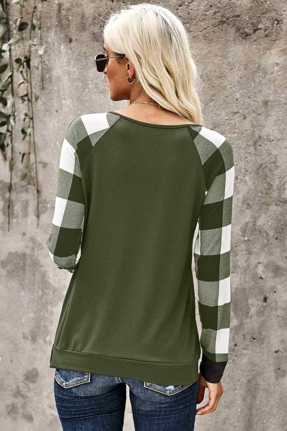 Green plaid long sleeve top with sequined pocket detail, showcasing a stylish and casual design.