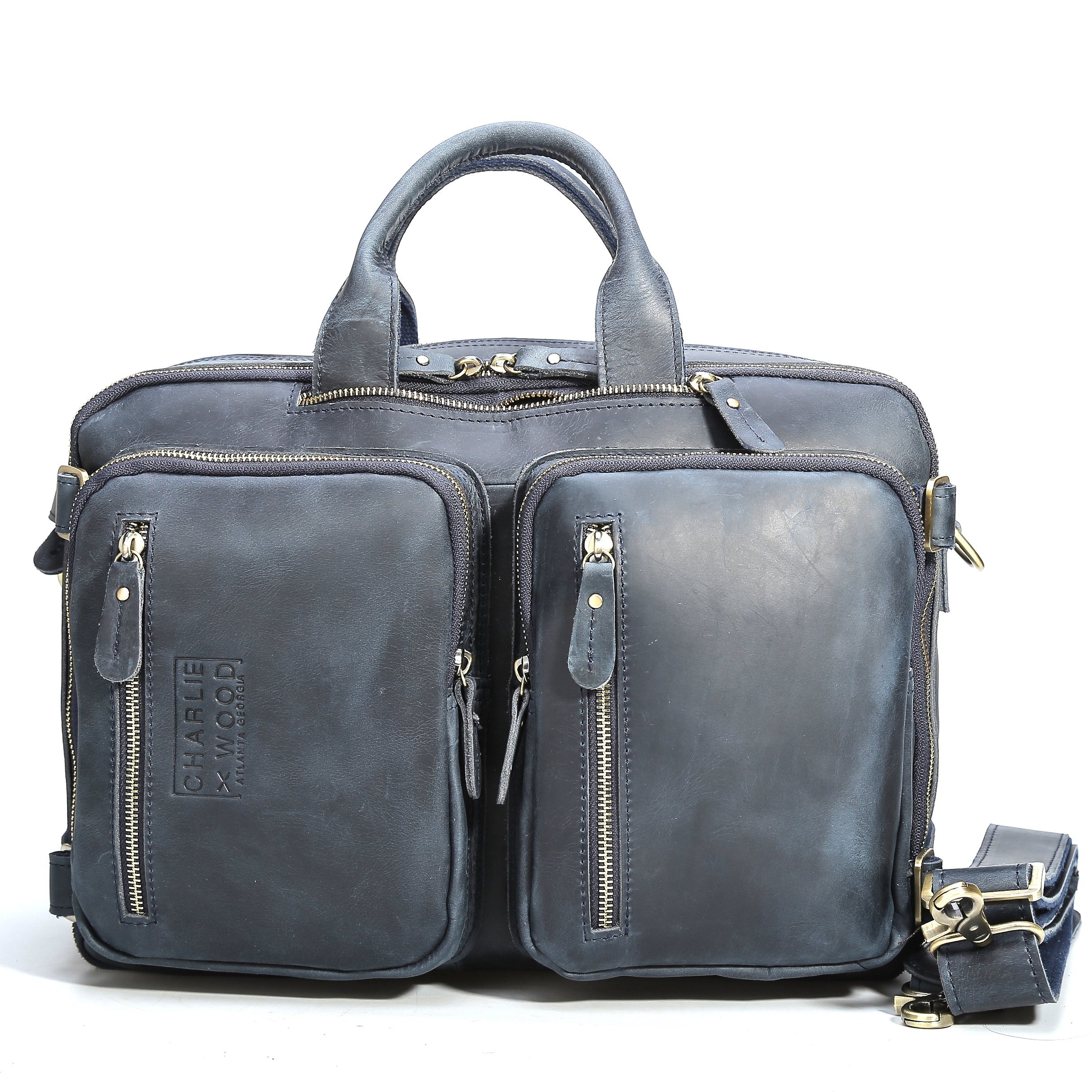 Hartwell leather bag in blue, showcasing its classic design and versatility as a backpack, briefcase, or messenger bag.