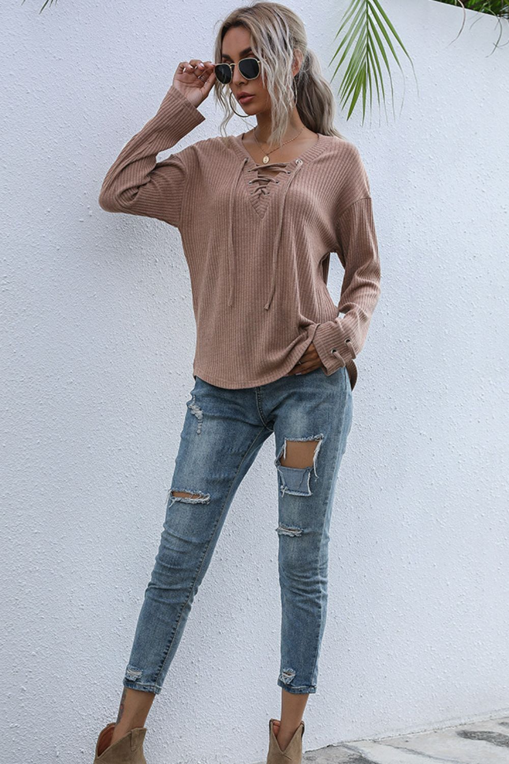 Lace-Up V-Neck Ribbed Top in various colors, featuring a stylish lace-up design and long sleeves.