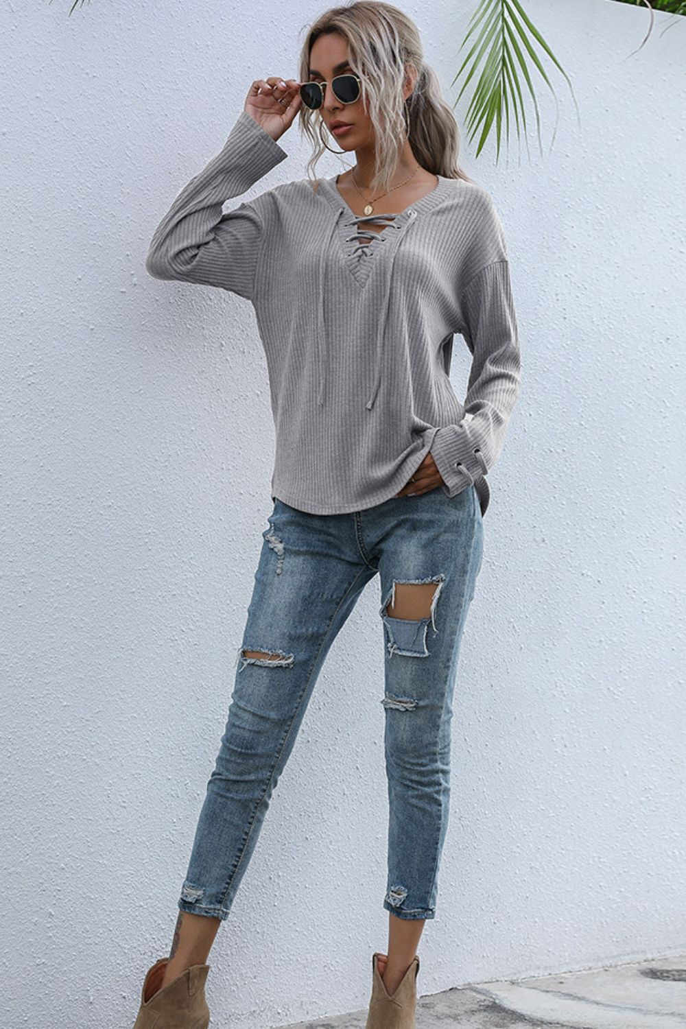 Lace-Up V-Neck Ribbed Top in various colors, featuring a stylish lace-up design and long sleeves.