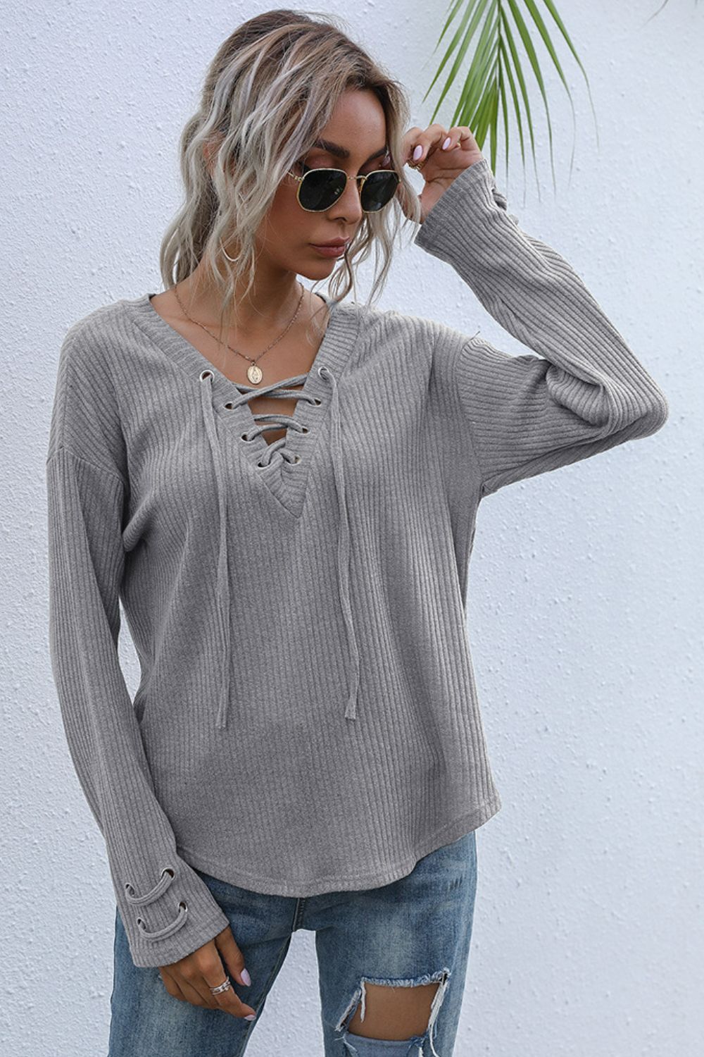 Lace-Up V-Neck Ribbed Top in various colors, featuring a stylish lace-up design and long sleeves.