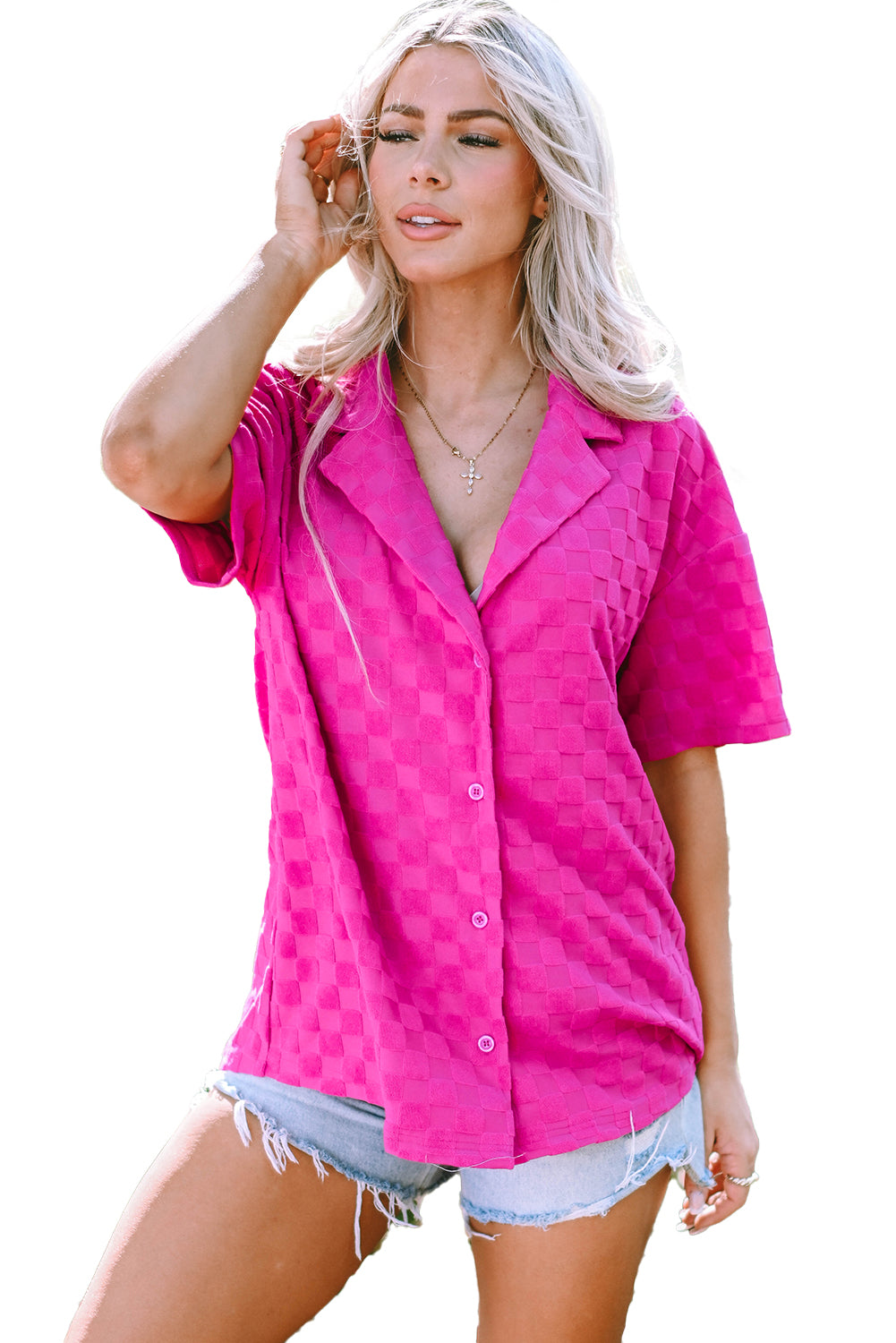 Bright pink lapel textured short sleeve shirt displayed on a hanger, showcasing its elegant design and chic style.