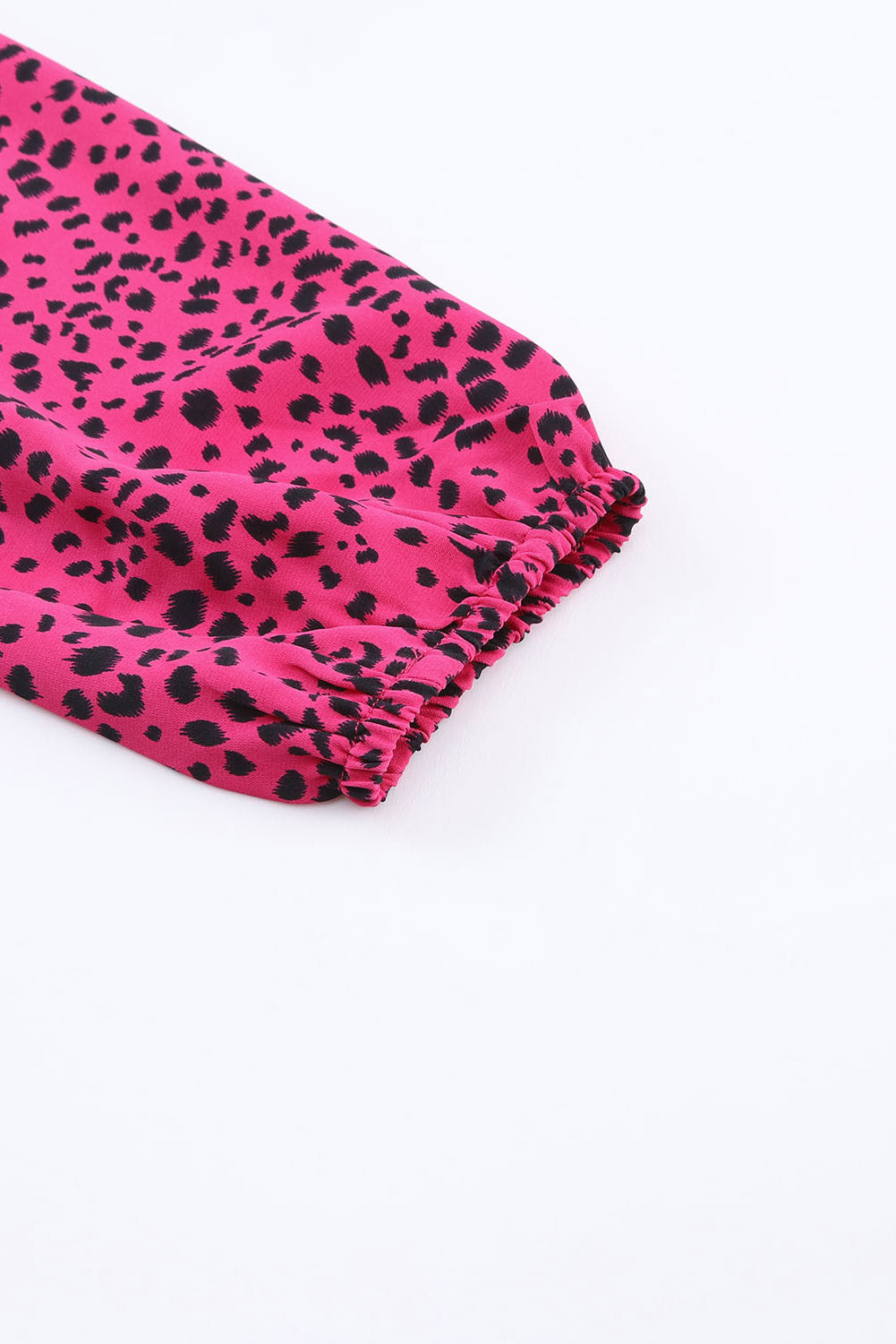 Leopard Print Pleated Blouse with Keyhole detail, featuring puff sleeves and a stylish design.