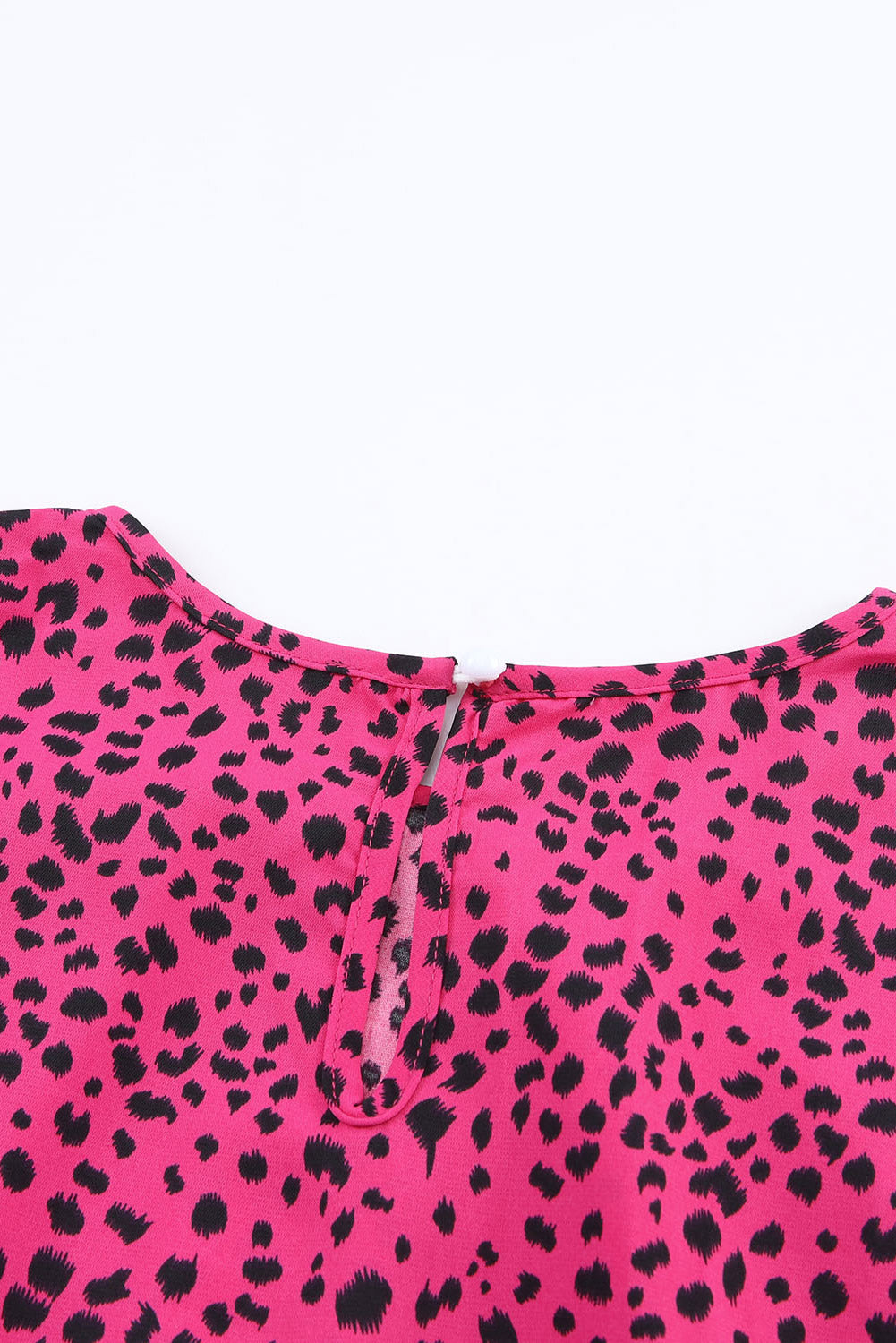 Leopard Print Pleated Blouse with Keyhole detail, featuring puff sleeves and a stylish design.