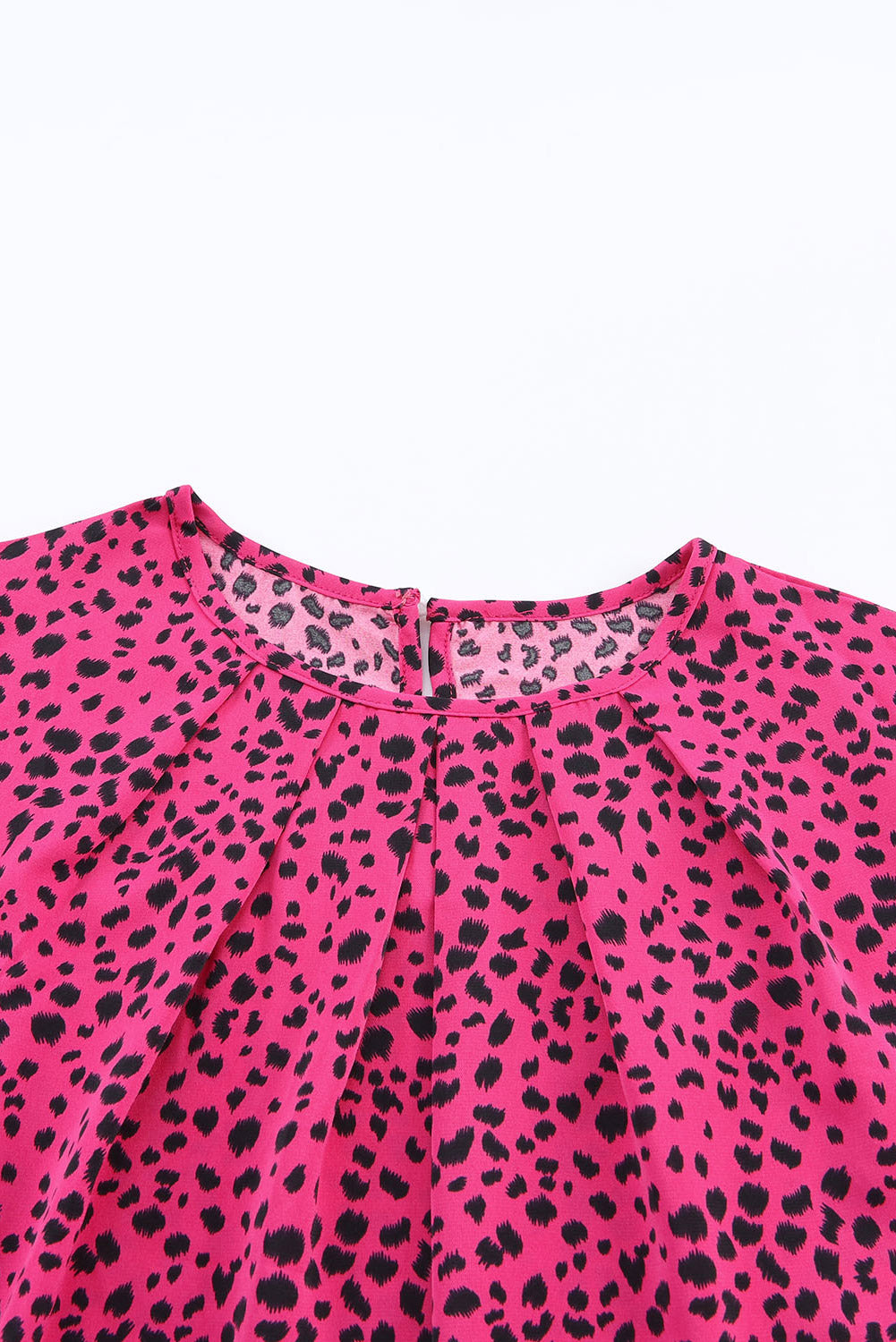 Leopard Print Pleated Blouse with Keyhole detail, featuring puff sleeves and a stylish design.