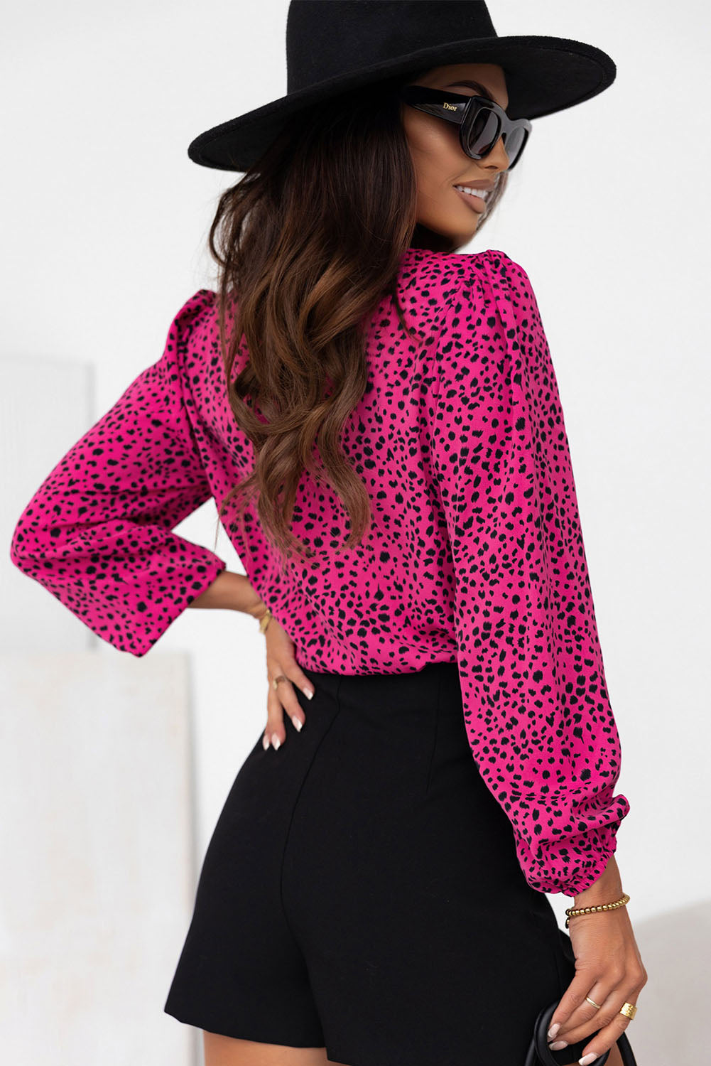 Leopard Print Pleated Blouse with Keyhole detail, featuring puff sleeves and a stylish design.