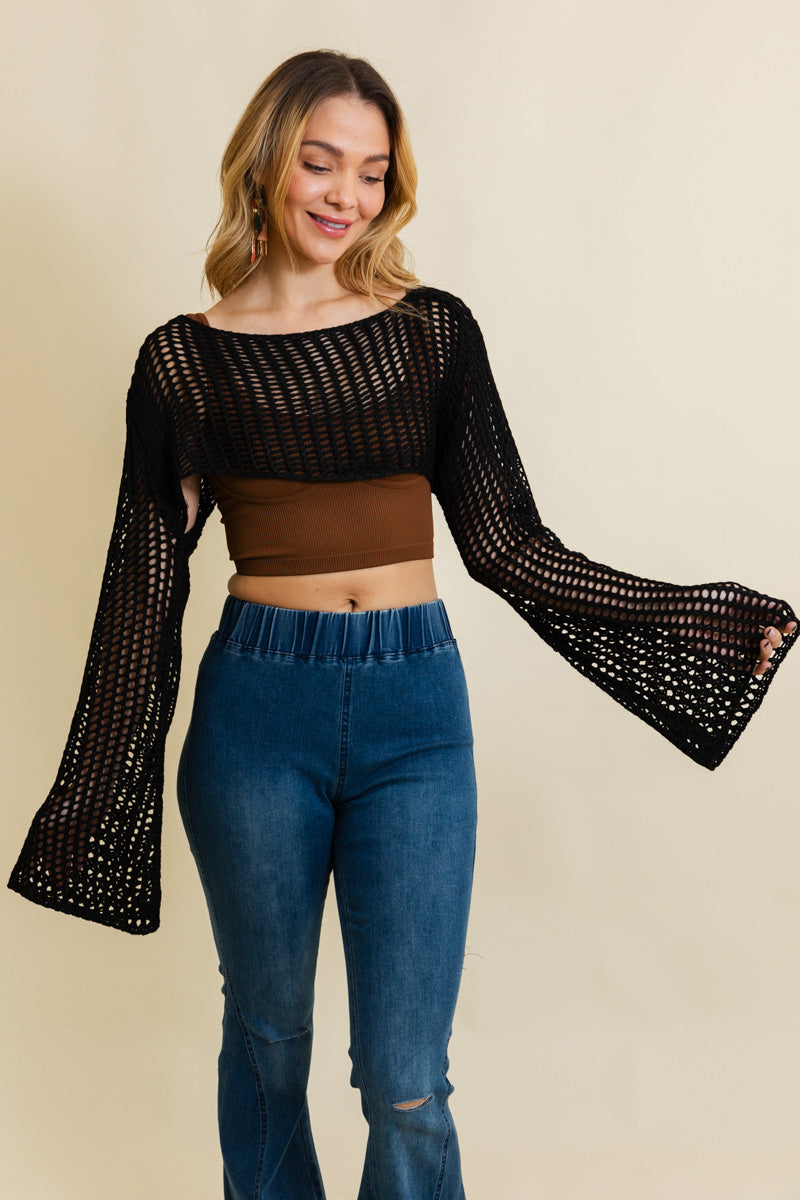 A cozy Loom Knitted Cropped Sweater in a stylish design, showcasing intricate knitted patterns and a modern cropped silhouette.