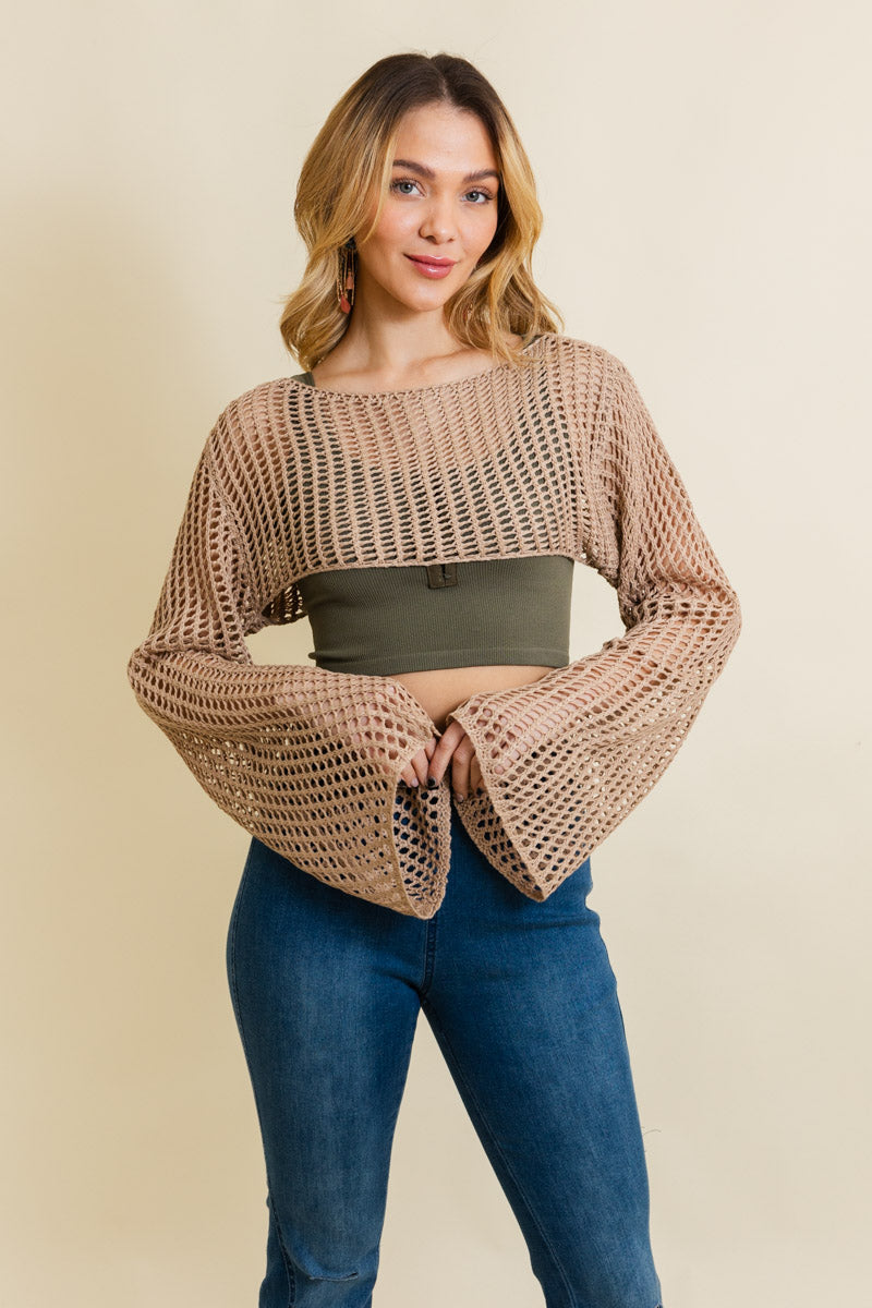 A cozy Loom Knitted Cropped Sweater in a stylish design, showcasing intricate knitted patterns and a modern cropped silhouette.