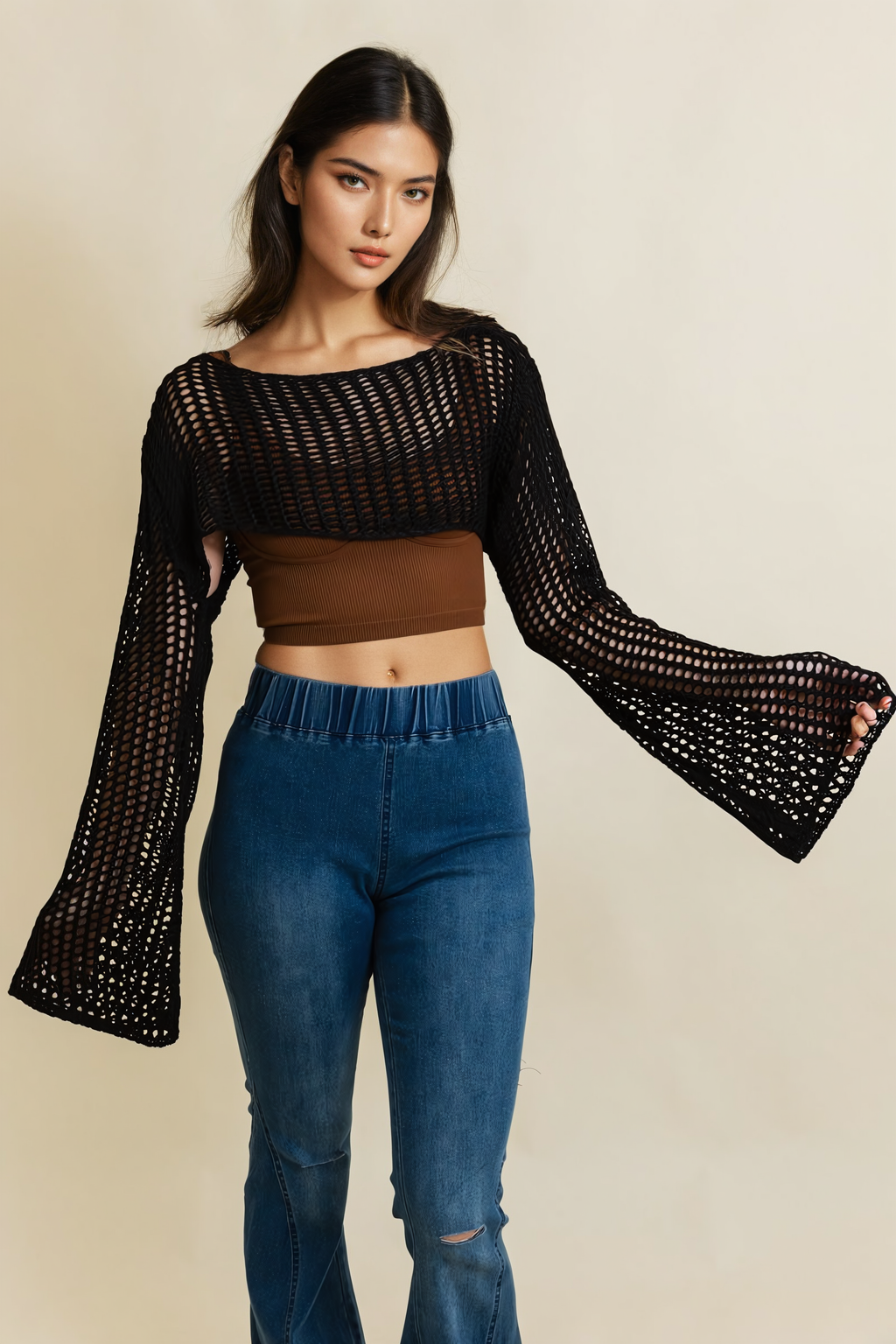 A cozy Loom Knitted Cropped Sweater in a stylish design, showcasing intricate knitted patterns and a modern cropped silhouette.