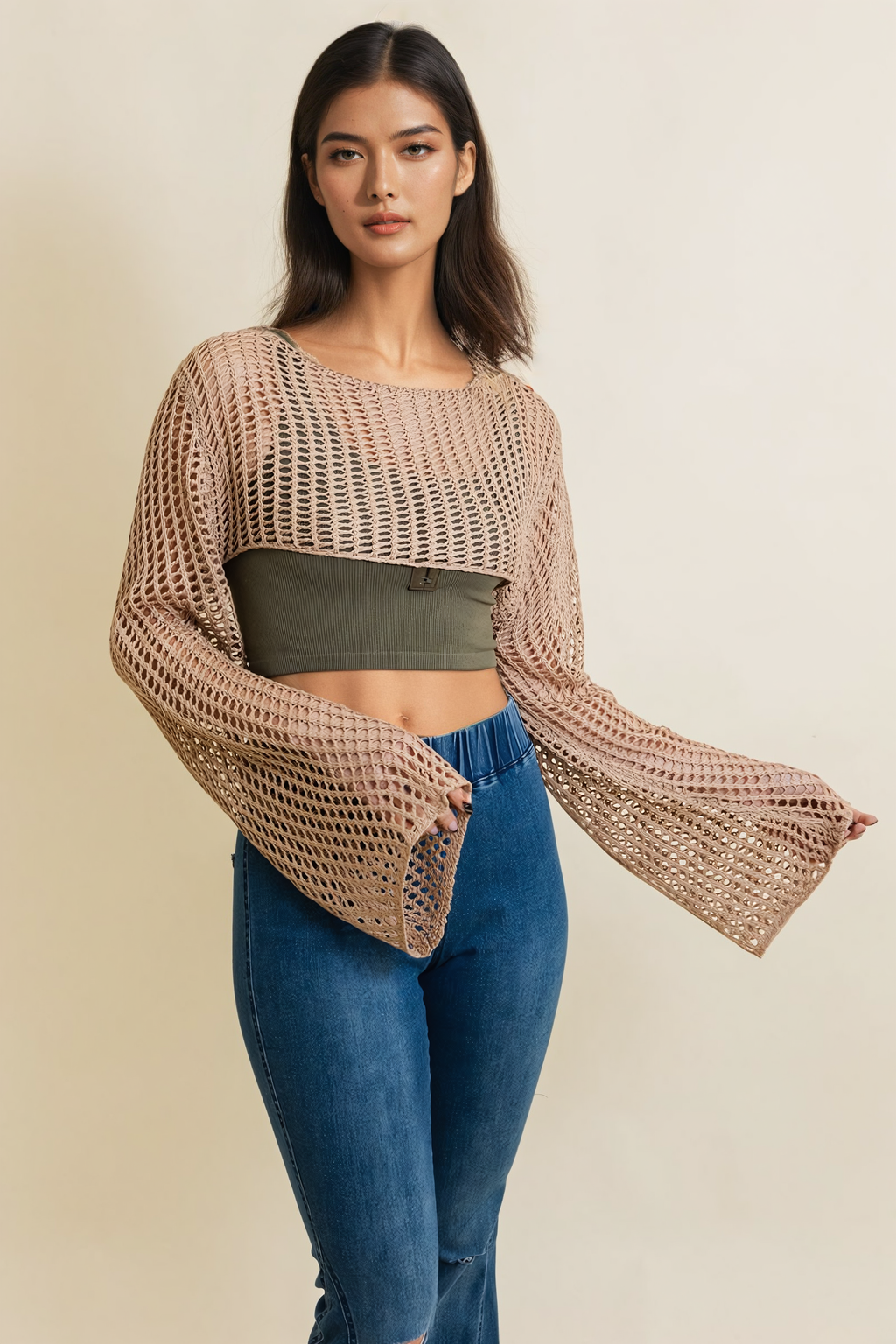 A cozy Loom Knitted Cropped Sweater in a stylish design, showcasing intricate knitted patterns and a modern cropped silhouette.