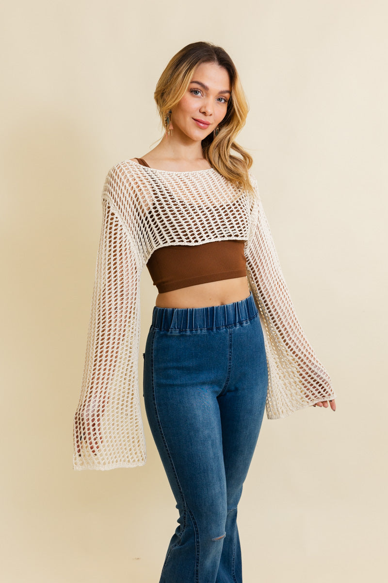 A cozy Loom Knitted Cropped Sweater in a stylish design, showcasing intricate knitted patterns and a modern cropped silhouette.