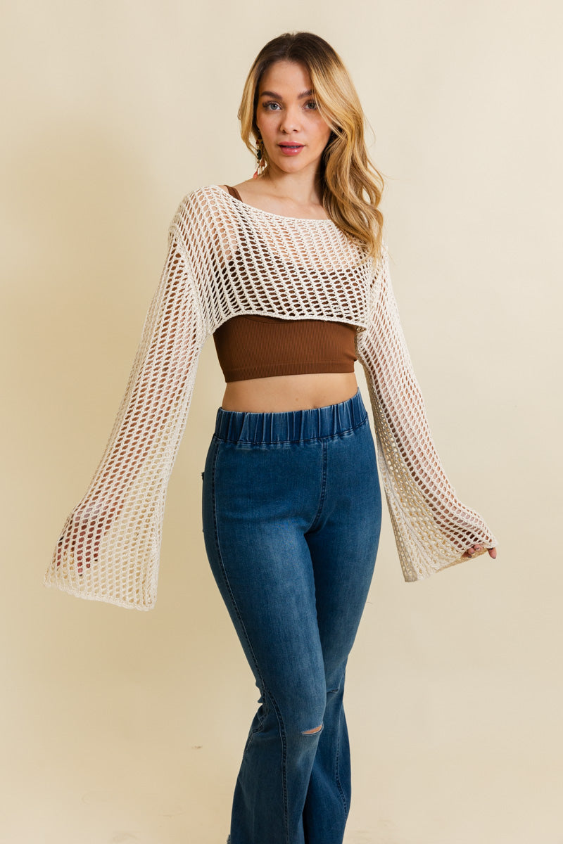 A cozy Loom Knitted Cropped Sweater in a stylish design, showcasing intricate knitted patterns and a modern cropped silhouette.