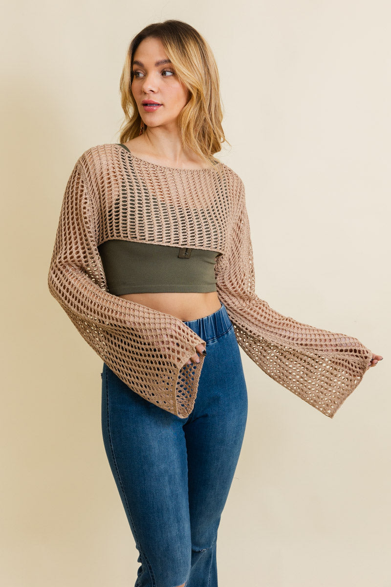 A cozy Loom Knitted Cropped Sweater in a stylish design, showcasing intricate knitted patterns and a modern cropped silhouette.