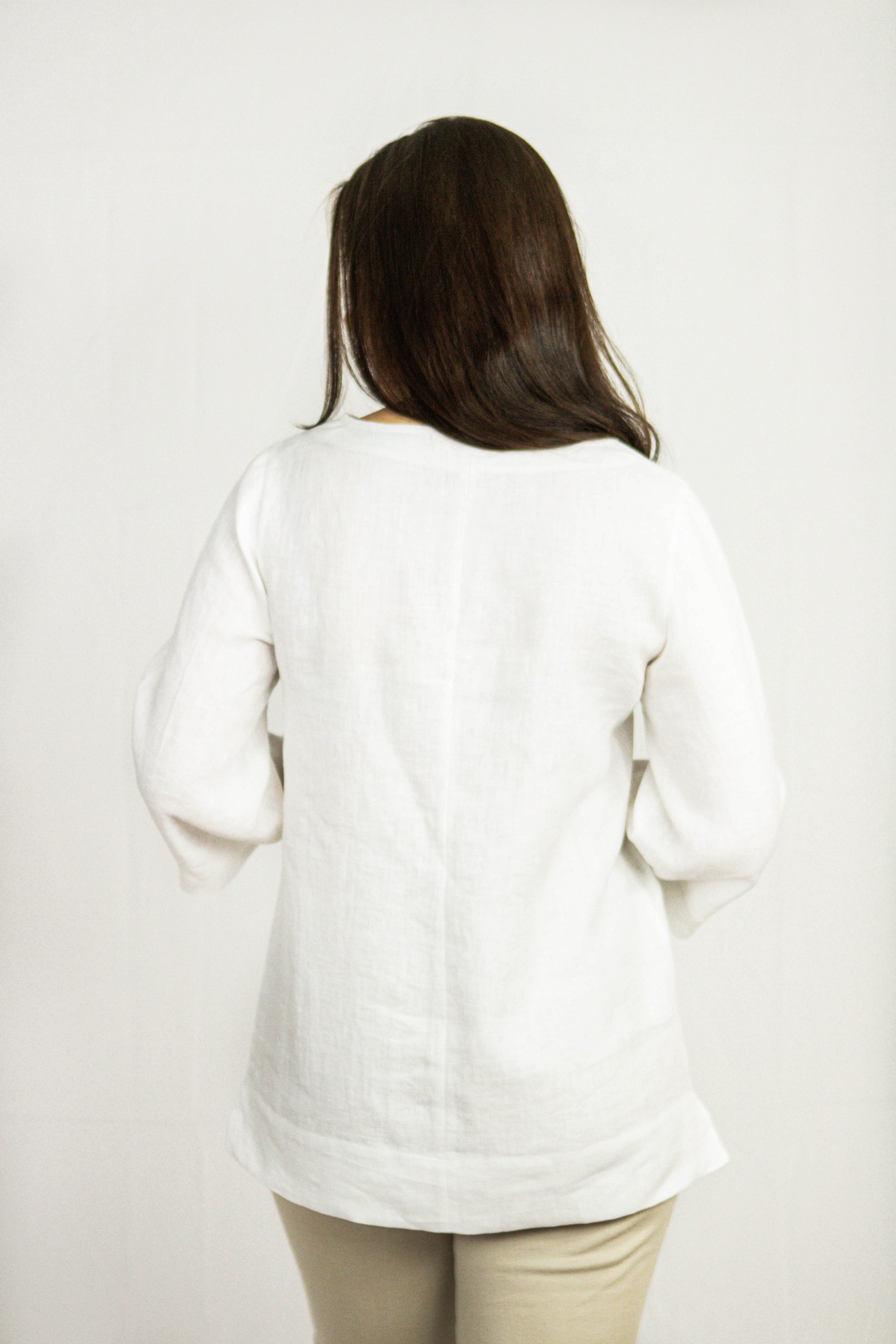 Natural Light linen oversize top in various colors, showcasing its elegant design and breathable fabric.