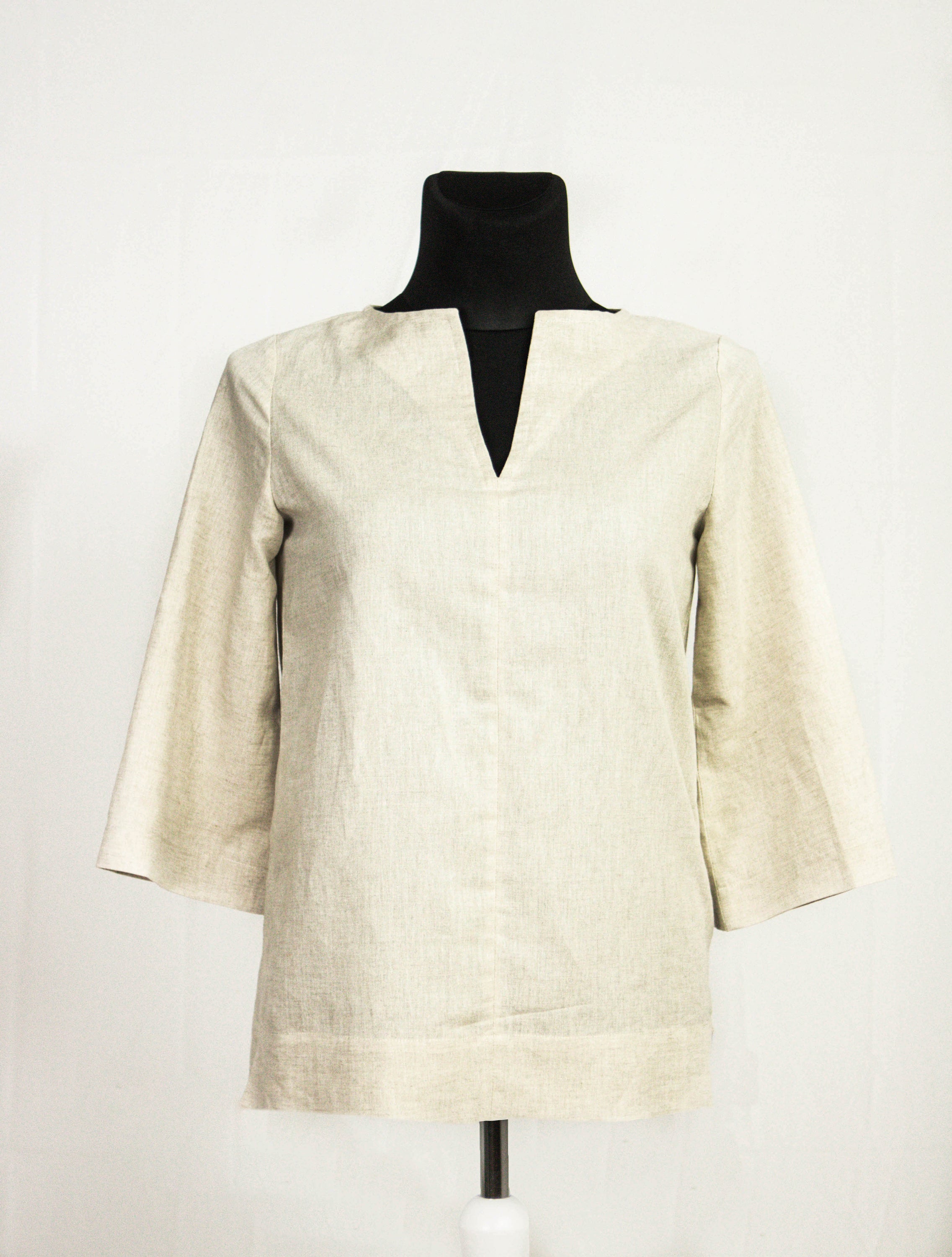 Natural Light linen oversize top in various colors, showcasing its elegant design and breathable fabric.