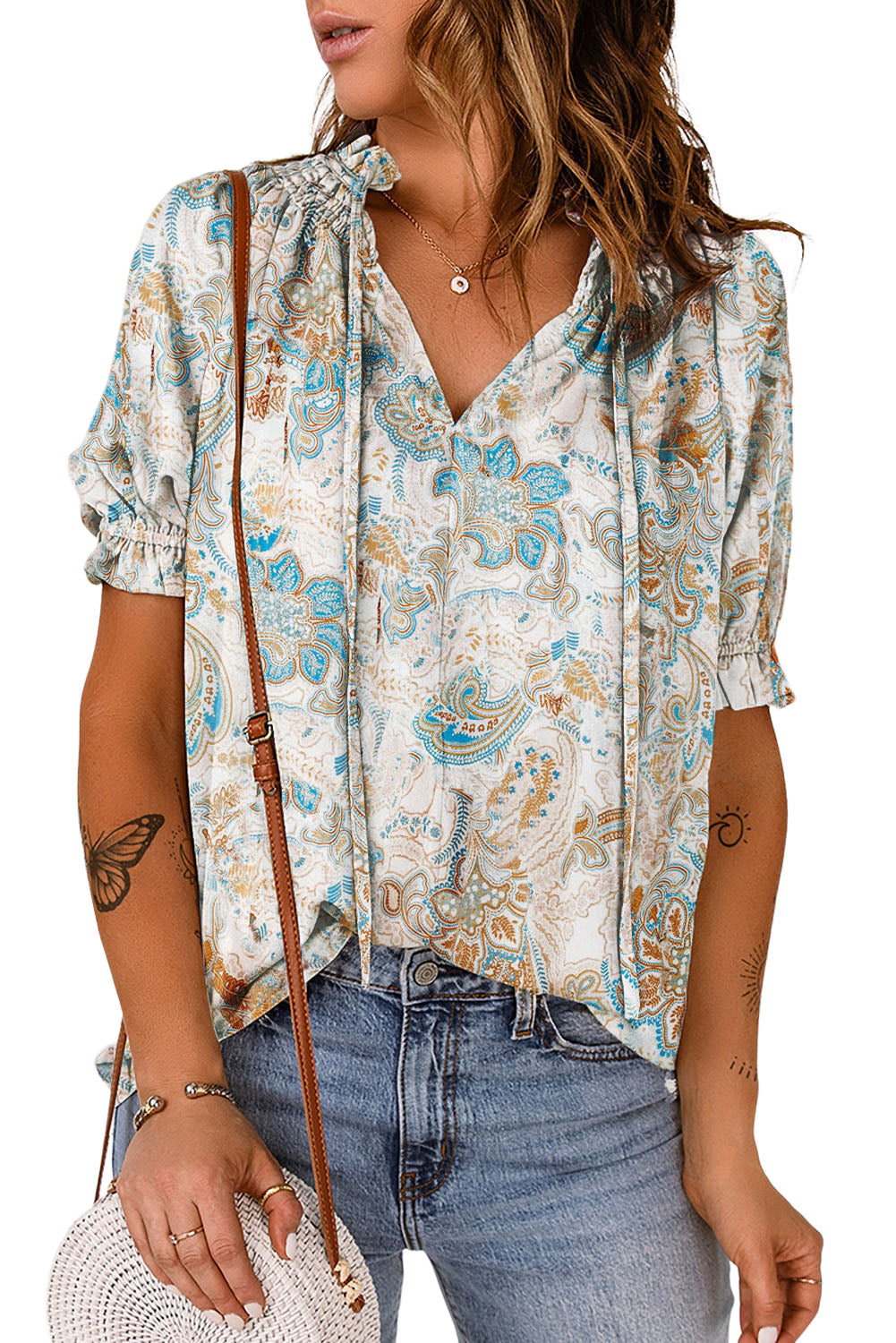 A stylish paisley pattern print V neck blouse with puff sleeves, showcasing a bohemian design perfect for casual and semi-formal occasions.