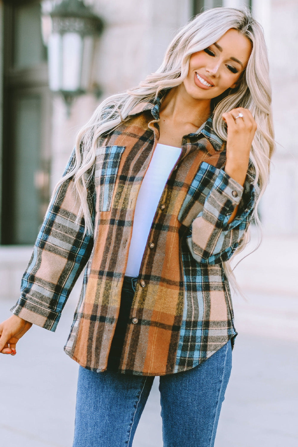 A stylish plaid color block buttoned shirt featuring functional pockets, perfect for fall fashion.