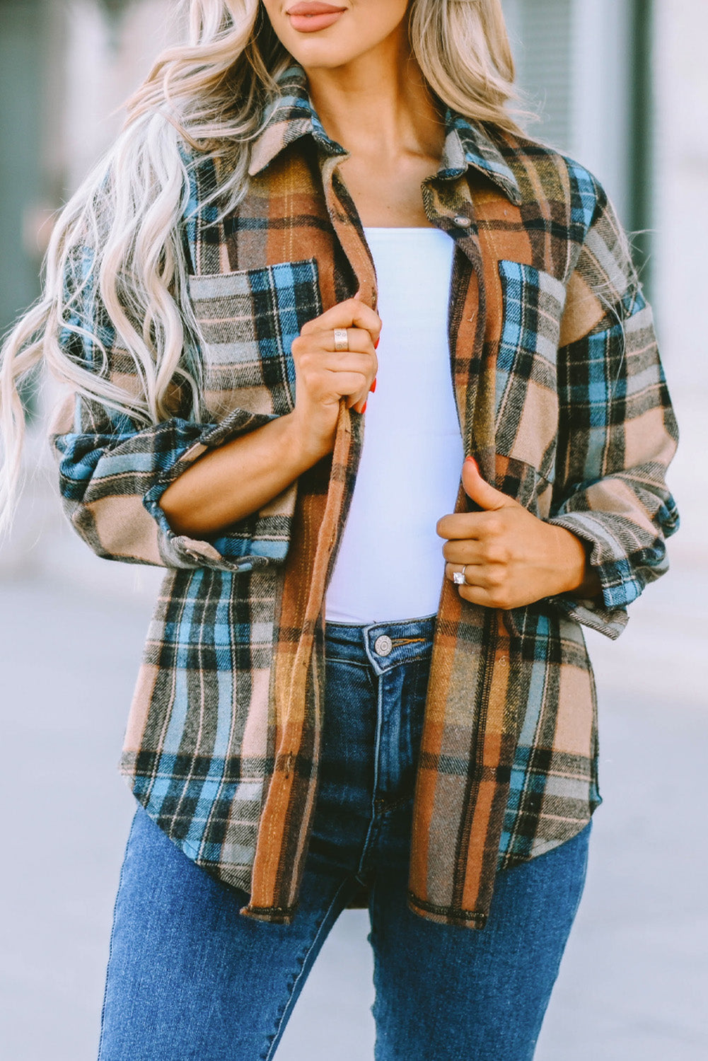 A stylish plaid color block buttoned shirt featuring functional pockets, perfect for fall fashion.